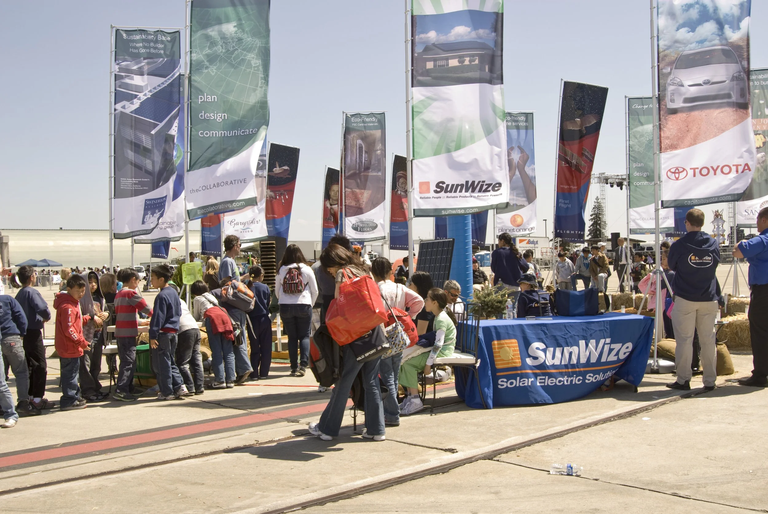 Custom street banner signage installed for public event to increase brand visibility and engagement