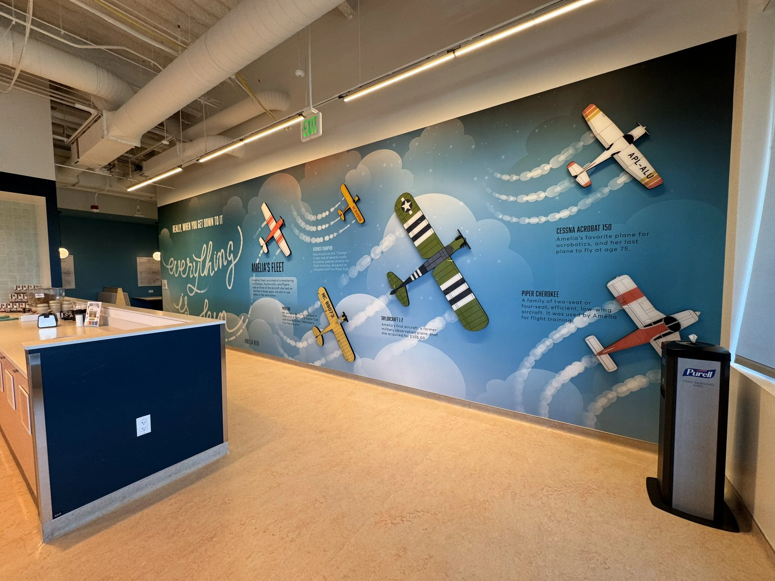 Expansive wall mural with dynamic illustrations designed to enhance movement and visual flow through the space.