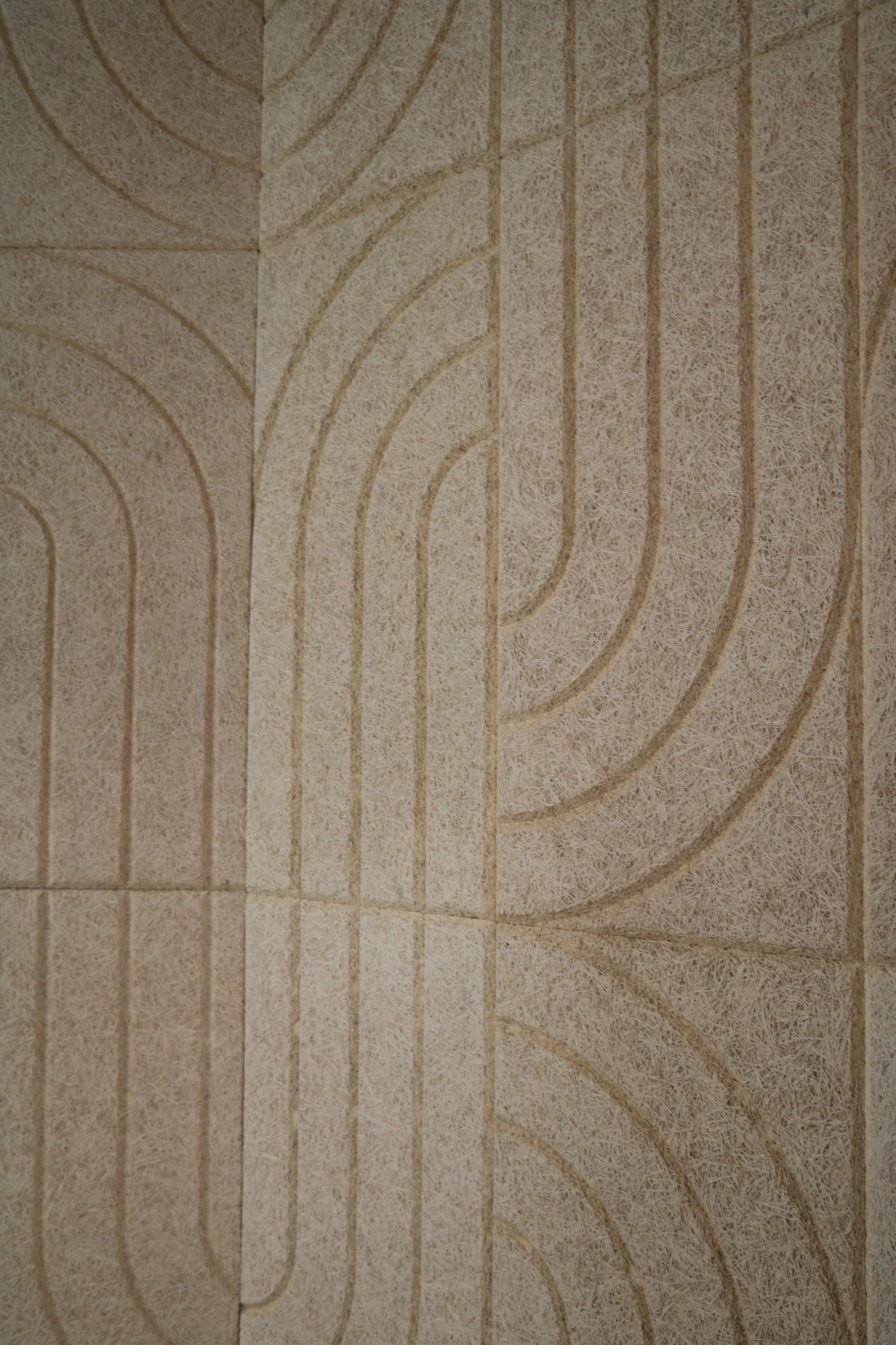Close-up of BAUX Wood Wool Curve acoustic panel texture showing geometric pattern for commercial sound absorption.