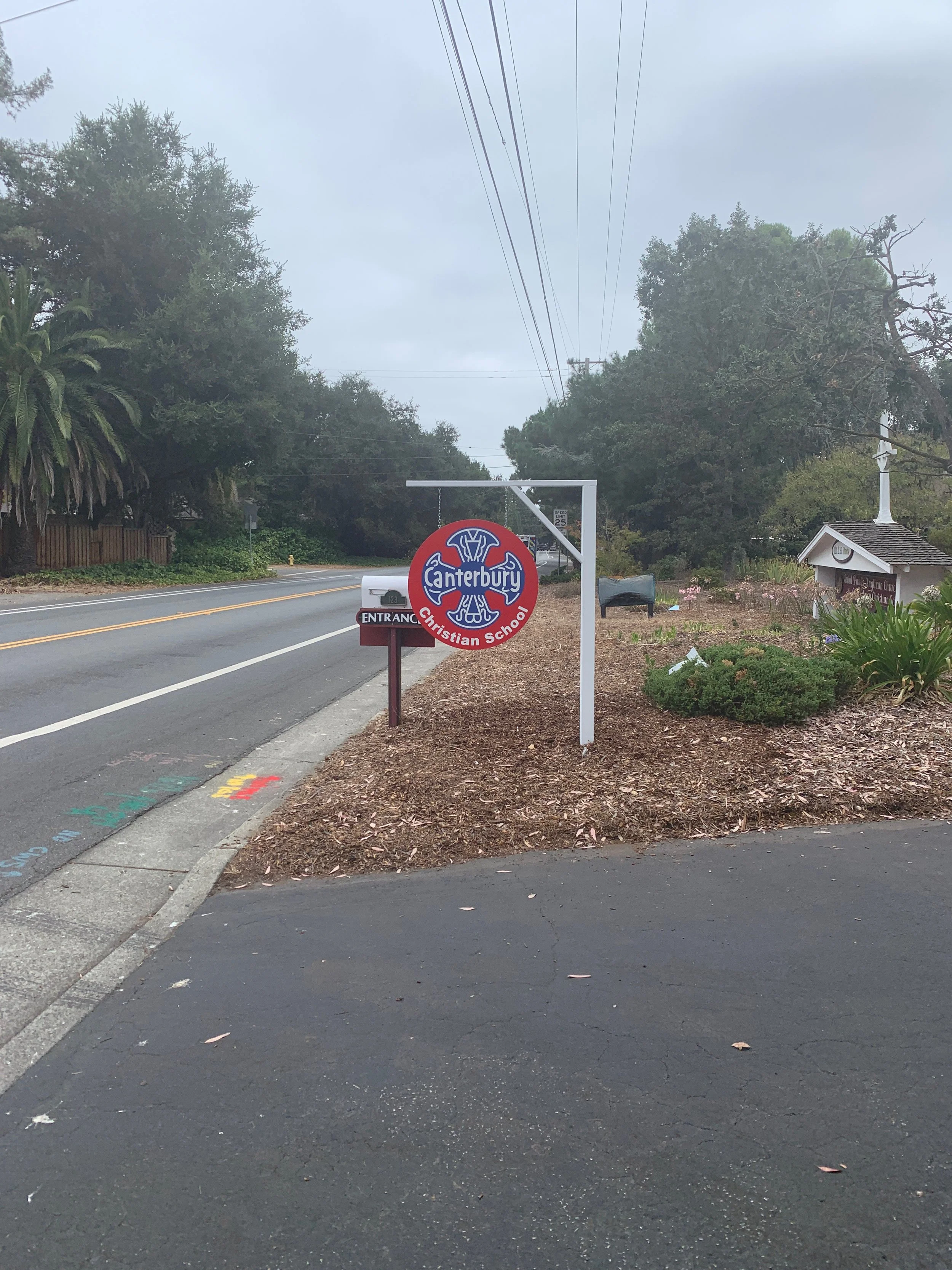 Custom outdoor environmental graphic installation designed to enhance wayfinding and create a branded entry experience.