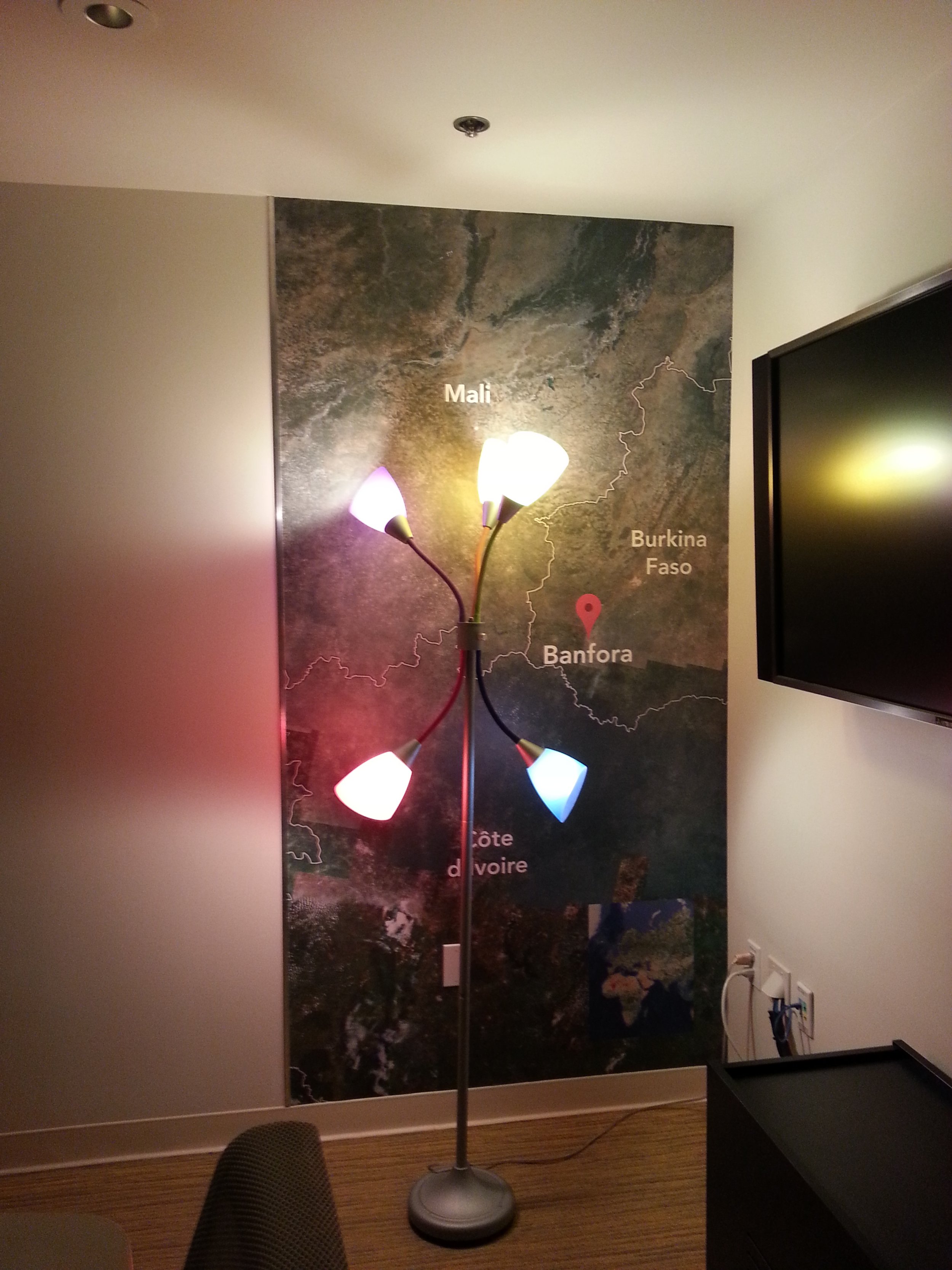 Abstract artistic wallcovering with bold color and lighting effects creating a dramatic commercial feature wall.