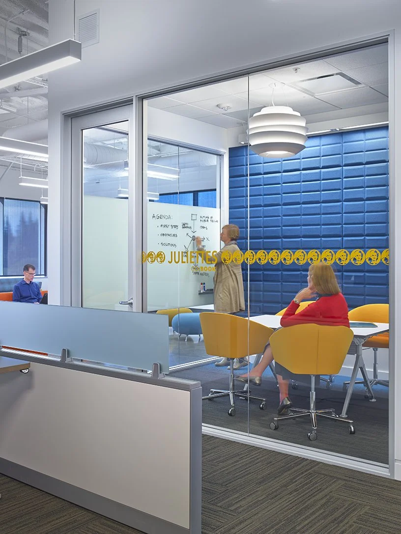 Frosted privacy window film with dot pattern installed in modern office conference space