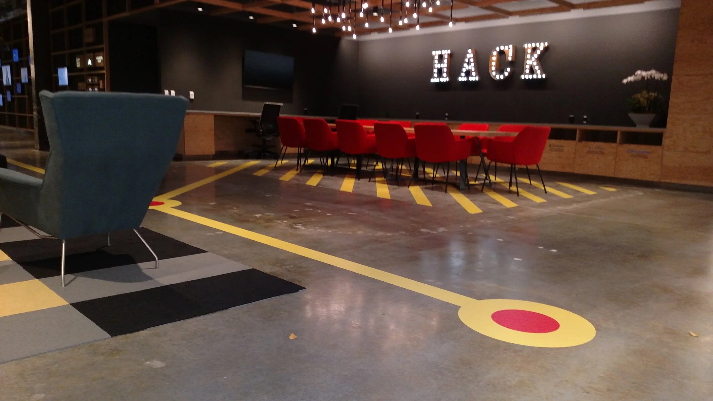 Commercial floor wayfinding graphics installed in high-traffic office area to direct circulation and enhance navigation