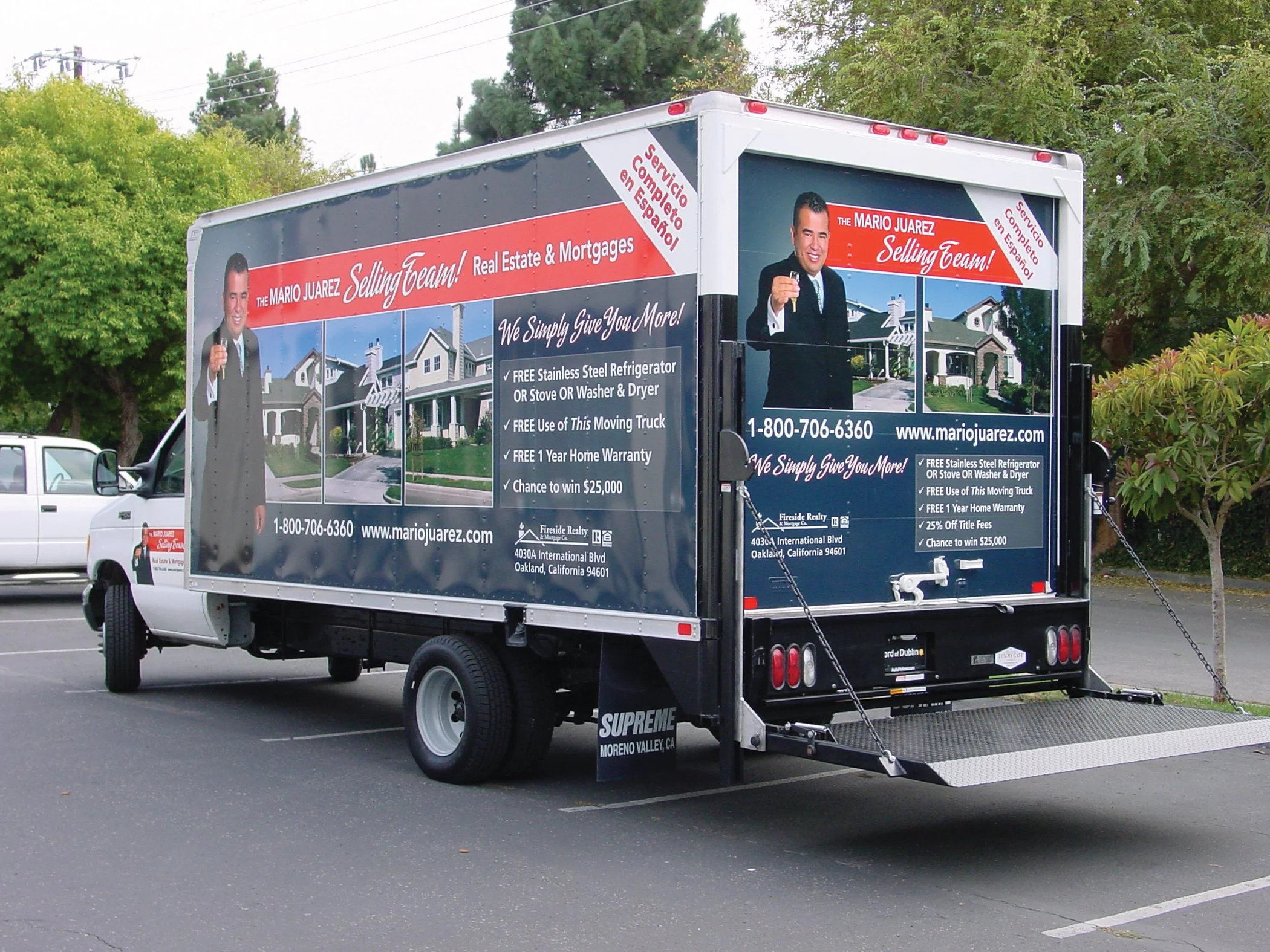 Custom full-wrap box truck vehicle graphics for real estate marketing, featuring large-format mobile advertising and branded fleet signage.