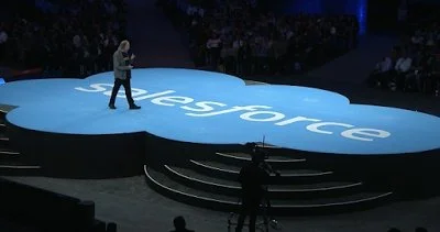 Large-scale branded stage floor graphics and event display designed for corporate conference presentation