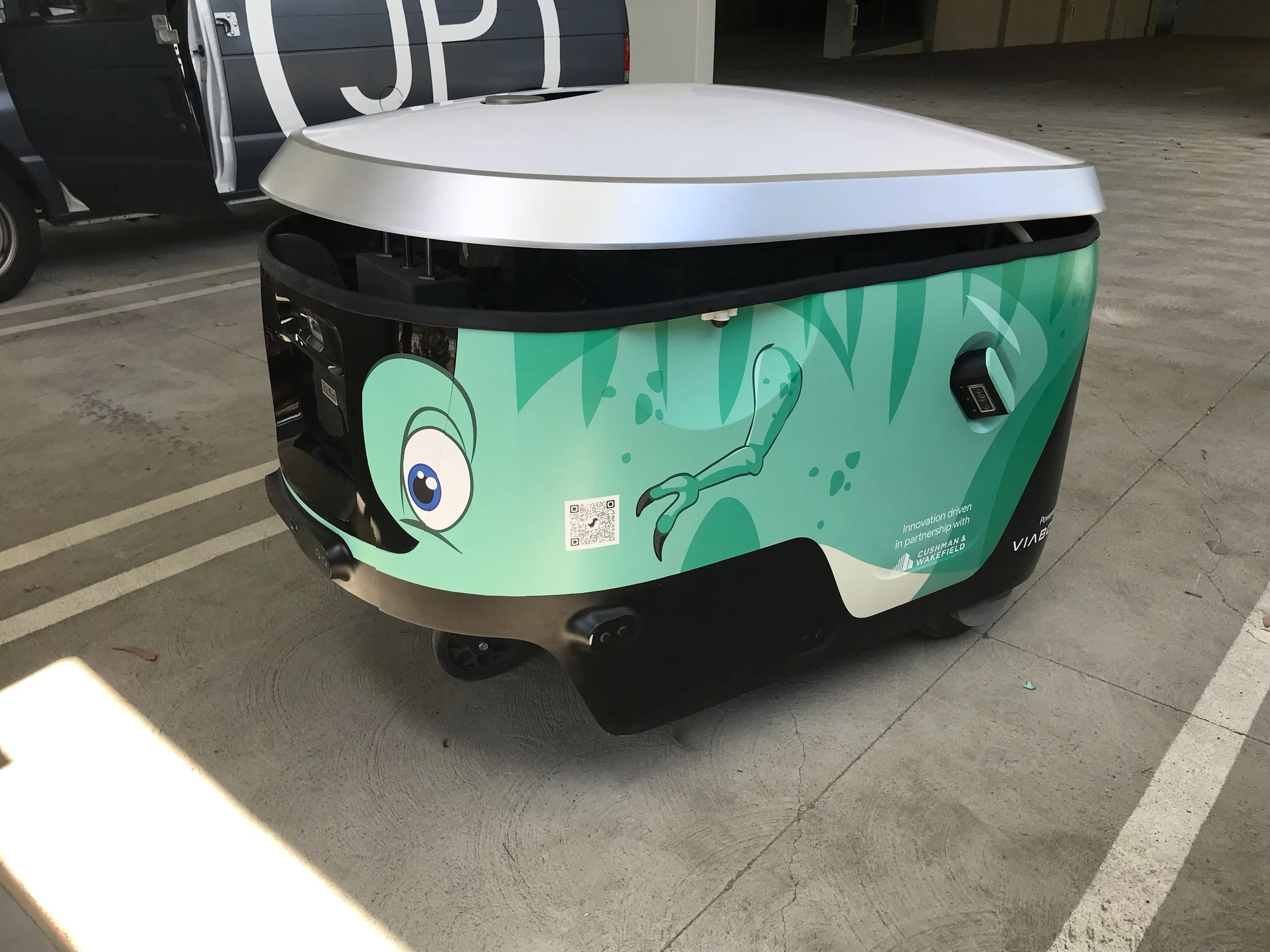Custom vinyl wrap applied to operational cart for durable outdoor brand visibility