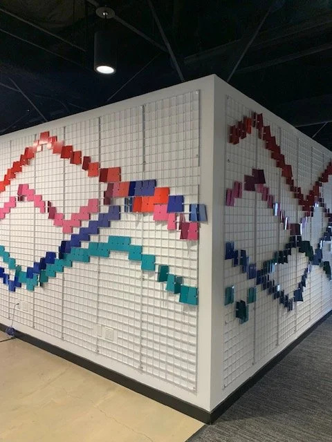 Finished 3D fin wall wrapping architectural surfaces at Google Santa Cruz, creating a continuous dimensional environmental graphics feature.