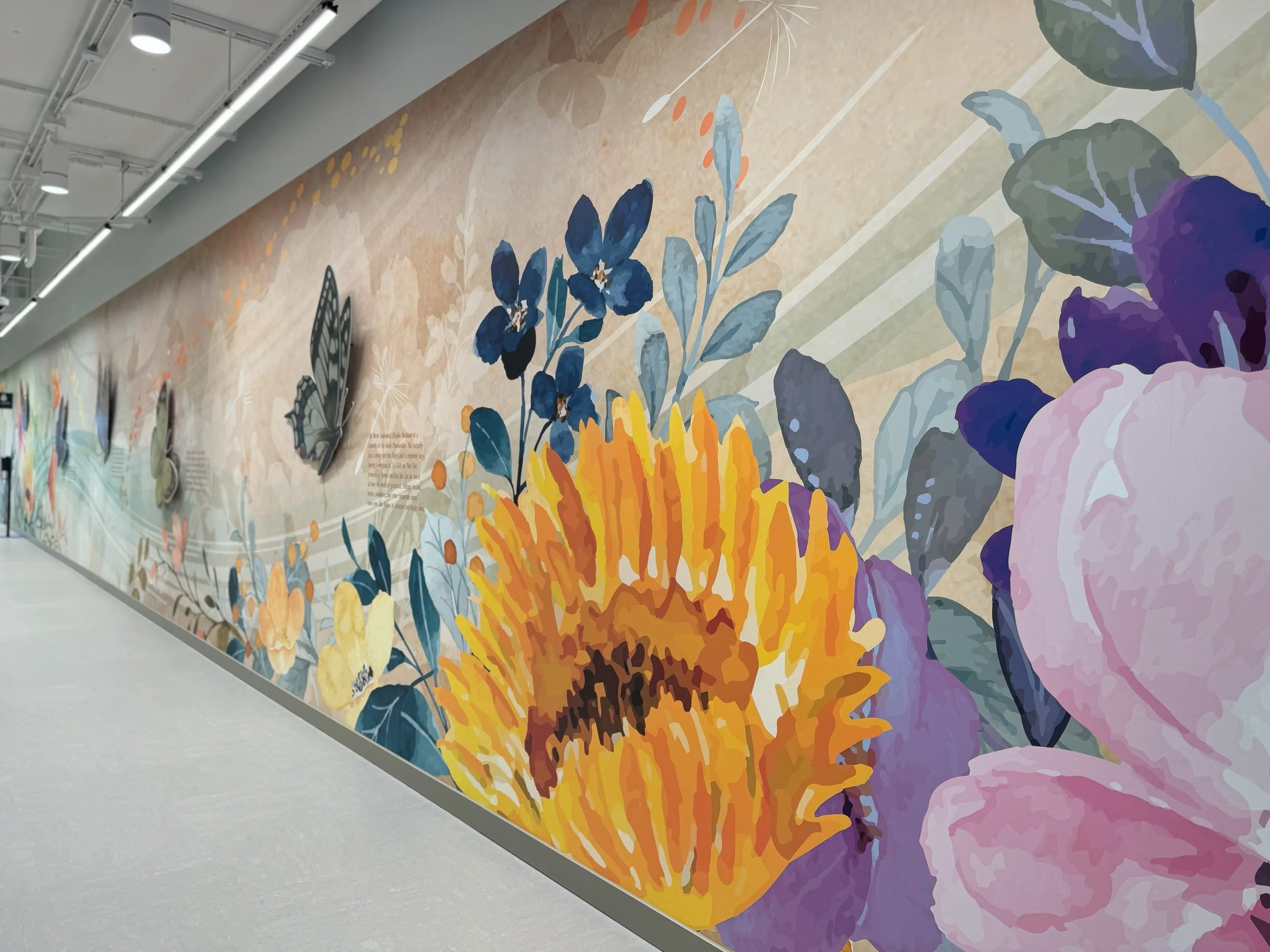 Large-scale nature-inspired environmental mural designed to create an engaging and welcoming office corridor experience.