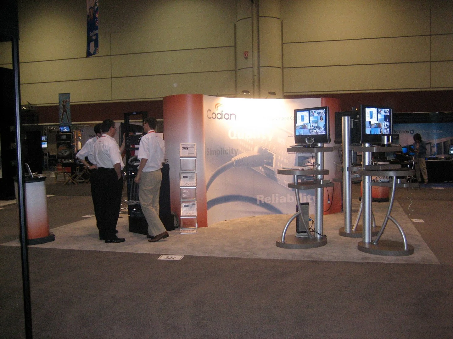 Custom modular trade show booth with architectural elements designed for brand storytelling and engagement