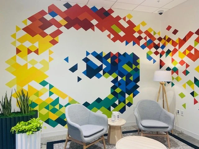 Large-scale dimensional wall installation transforming the space with texture, color, and brand expression.