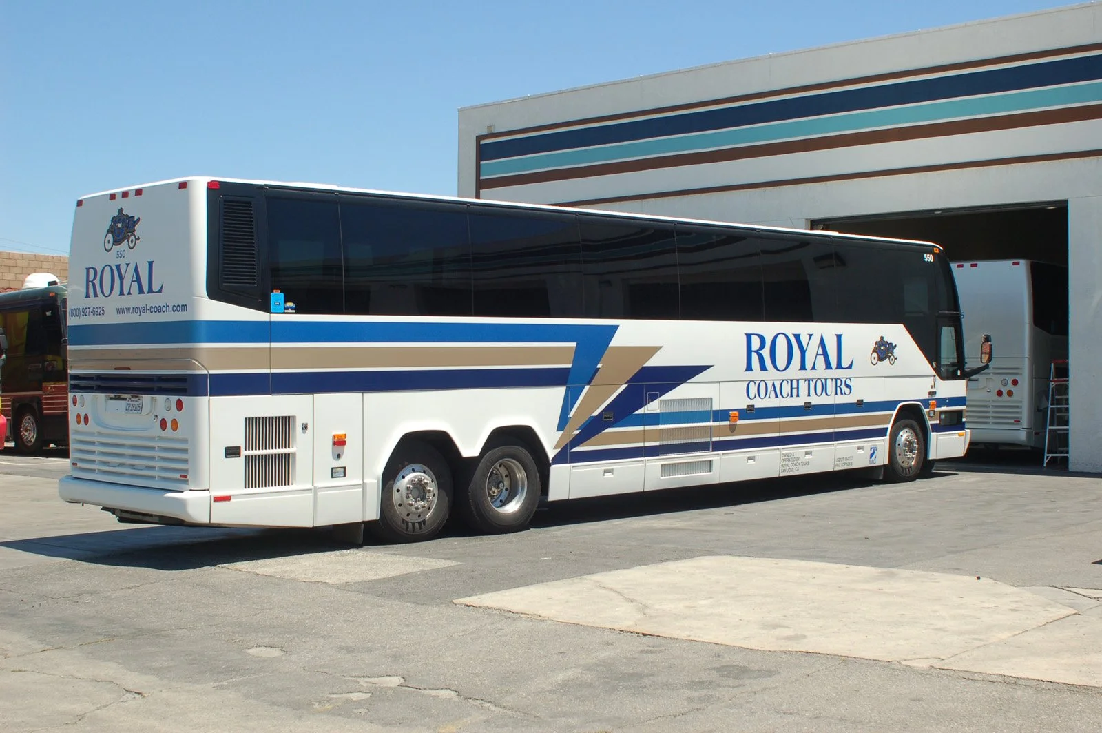 Custom coach bus wrap with large-format commercial graphics for transportation branding.
