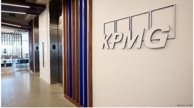 Finished dimensional KPMG logo signage on interior feature wall at the KPMG San Jose office, integrated with architectural slat design.