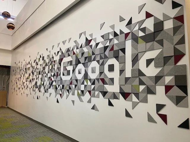 Branded environmental acoustic feature wall enhancing workplace identity and sound performance