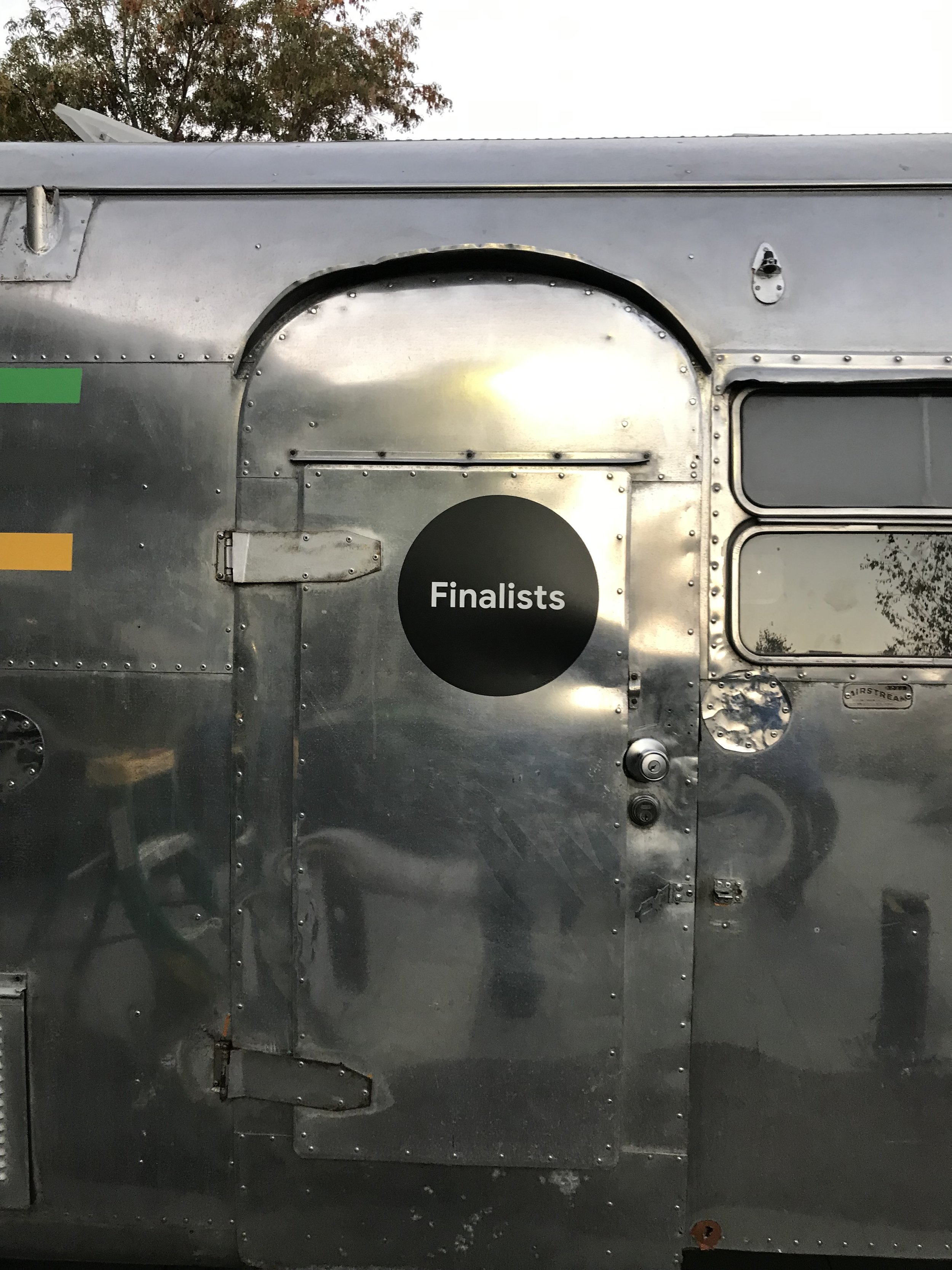 Partial trailer wrap with clean logo branding for commercial transport equipment