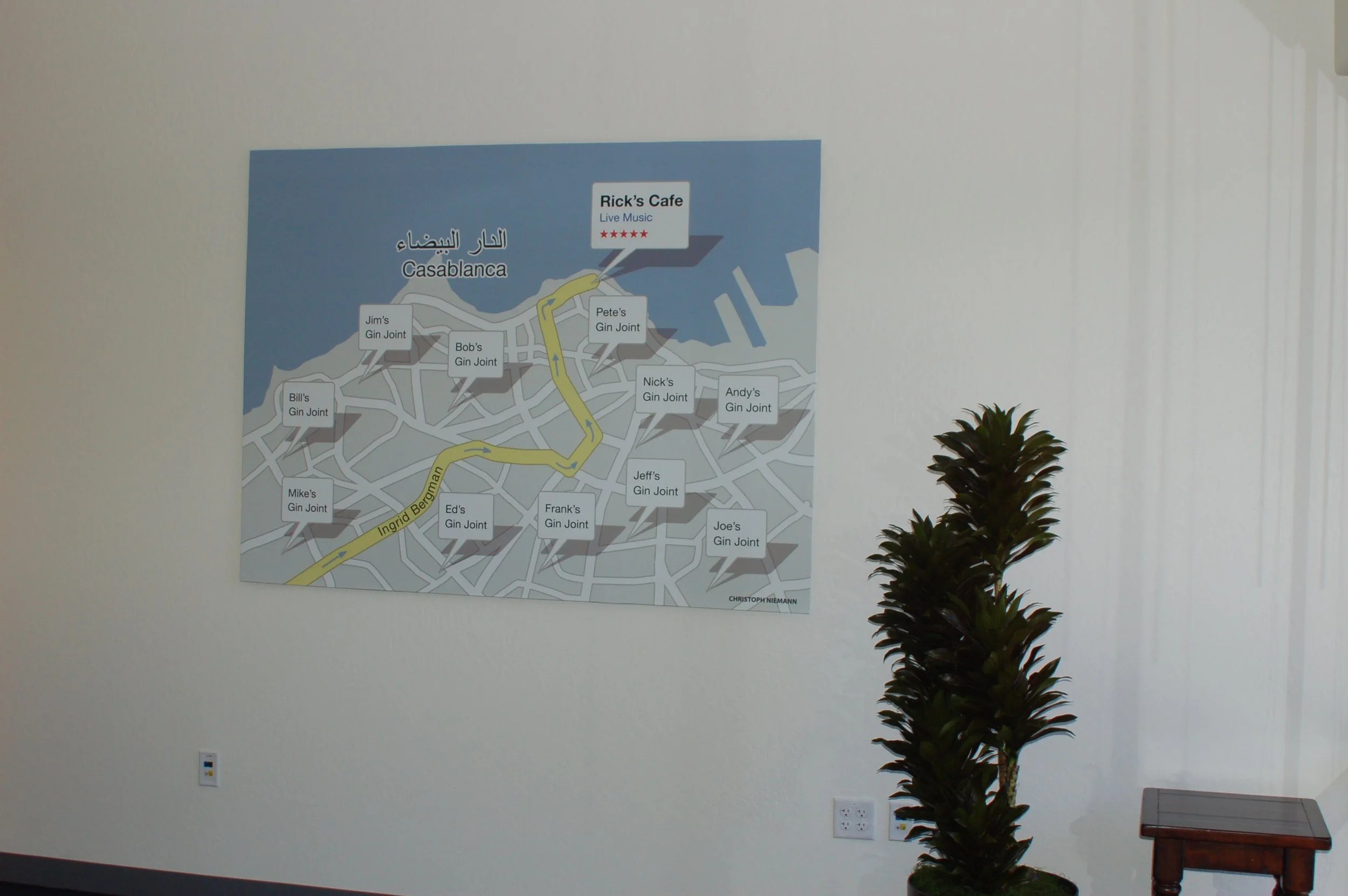 Custom printed world map wall graphic installed in a modern office for wayfinding and branded environmental design.
