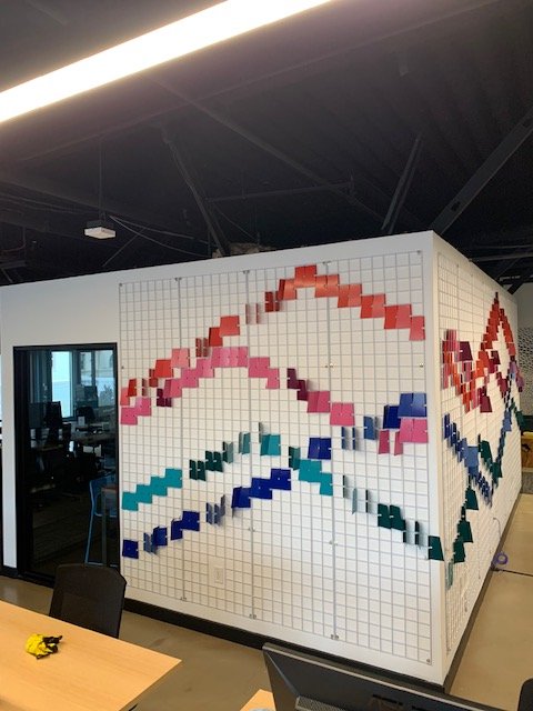 Completed custom 3D fin wall installation at Google Santa Cruz, featuring layered dimensional panels with vibrant color pattern for a branded architectural feature.
