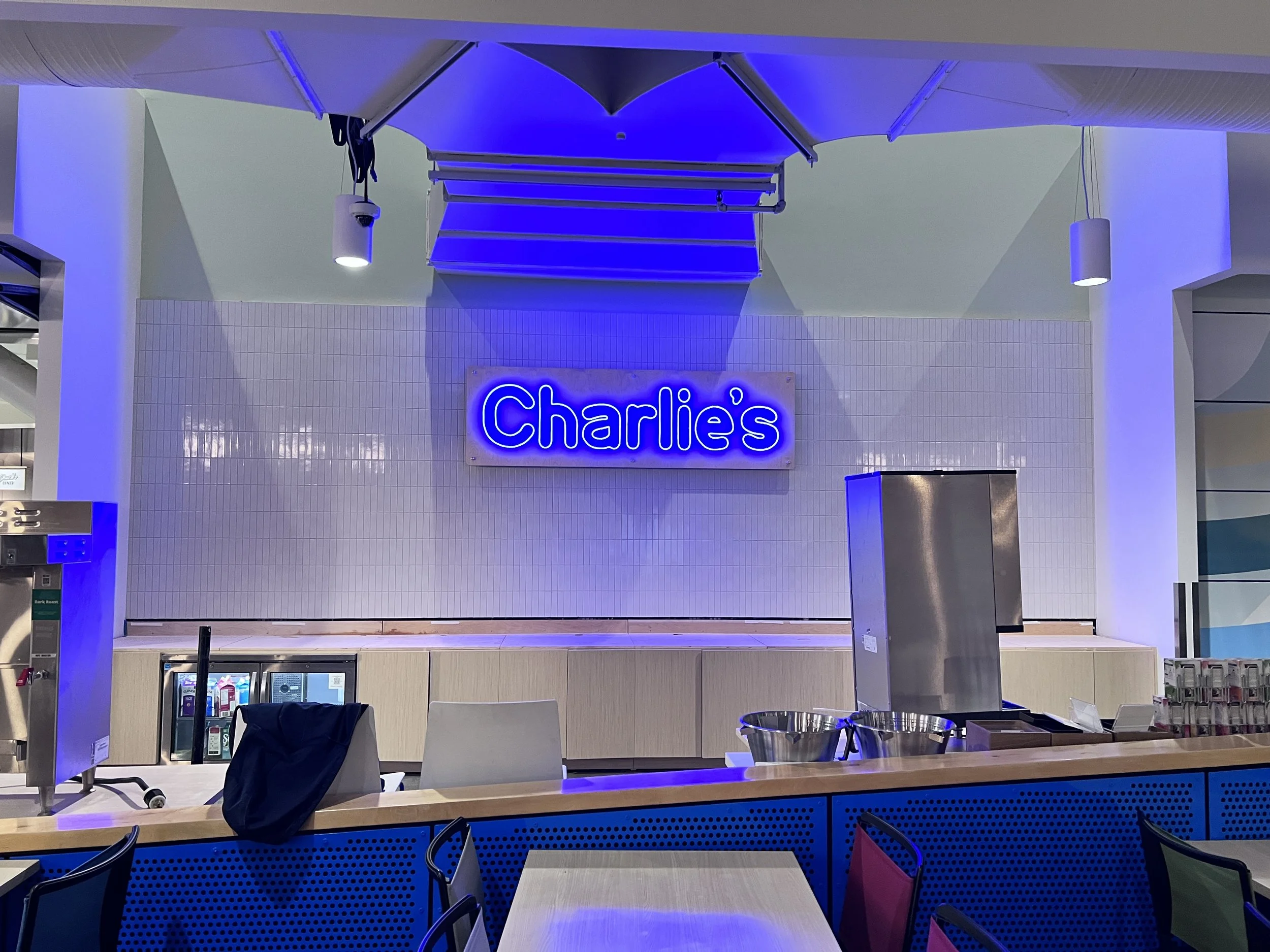 Illuminated dimensional logo signage creating a high-impact branded feature in corporate environment