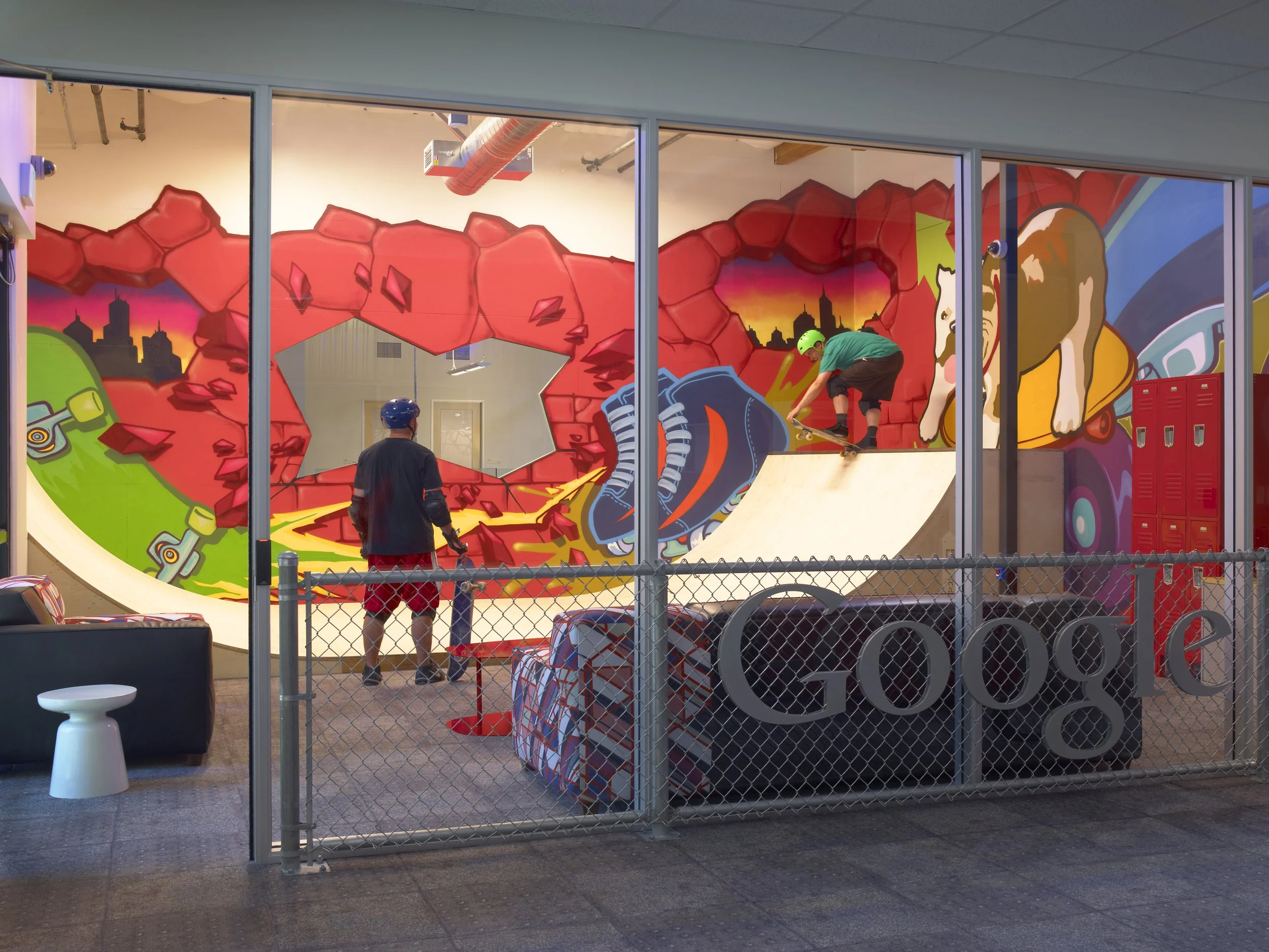 Custom printed environmental graphics and large-format wallcovering installed in a corporate office to create an immersive branded interior