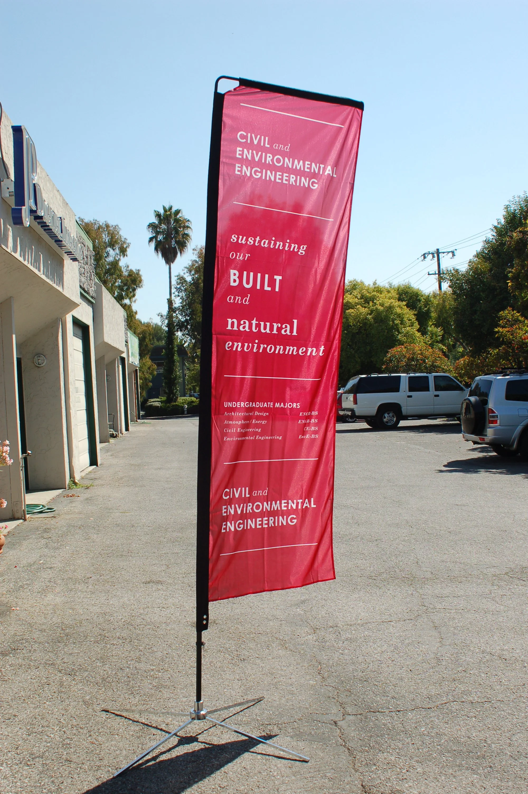 Custom vertical campus banner installed to support branding and directional visibility outdoors