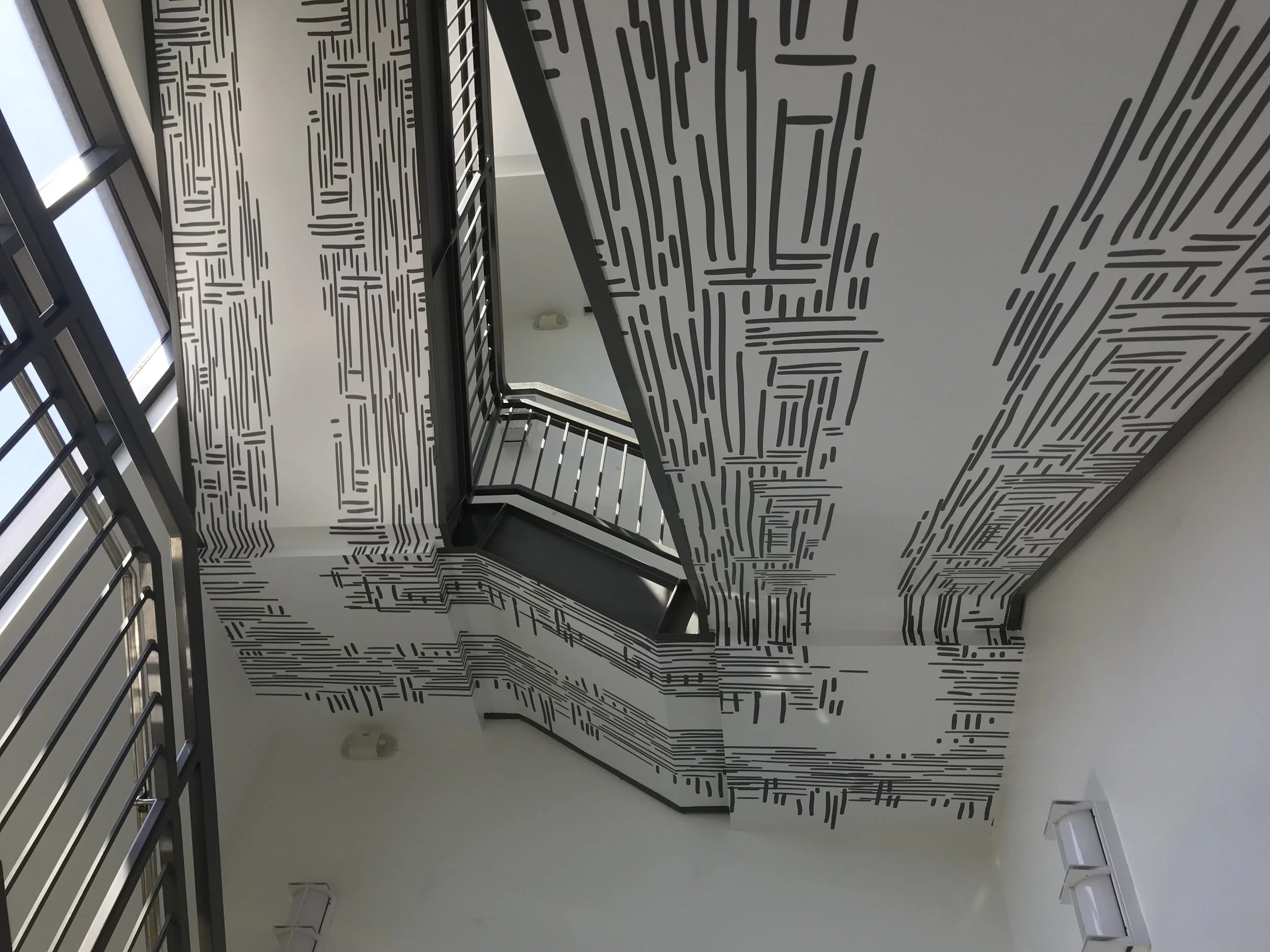 Close-up of completed stair wallcovering at Google Santa Cruz, demonstrating seamless installation and high-quality large-format print application.