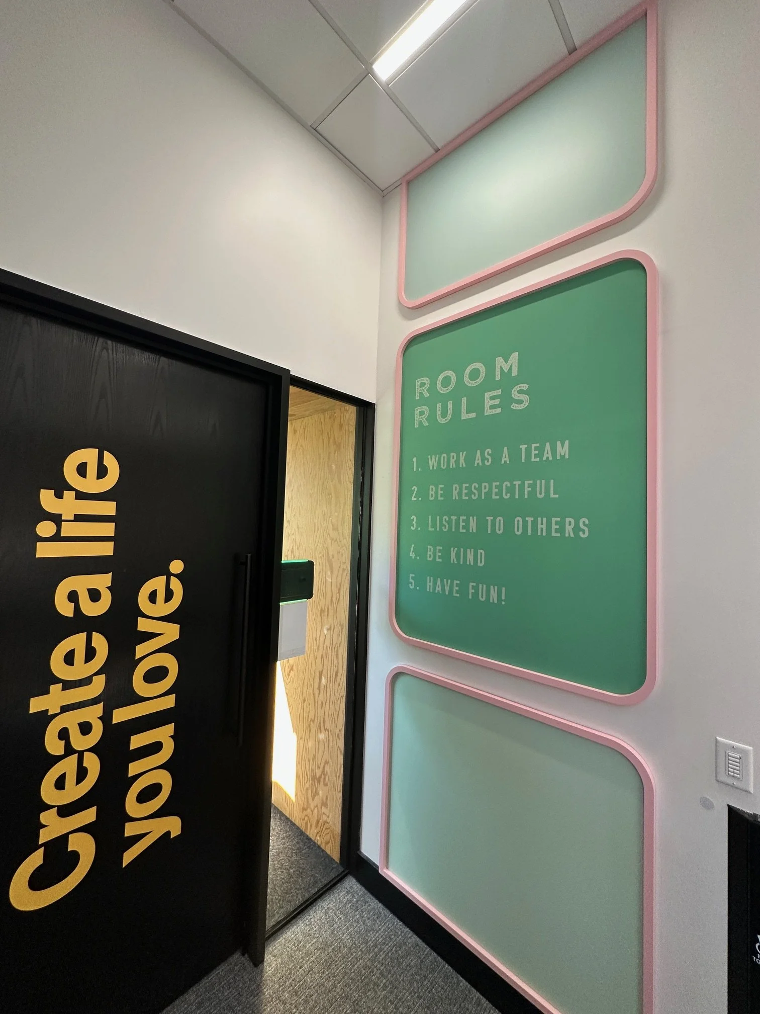 Pinterest San Francisco interior featuring large-scale typography wall graphics and branded environmental design installed by JP Digital.