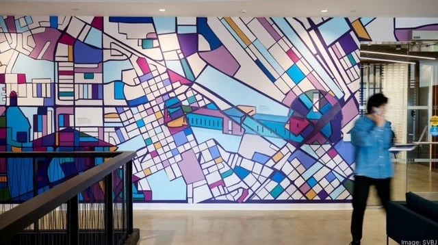 Finished custom environmental graphic wallcovering mural installed in workplace common area at the KPMG San Jose office.