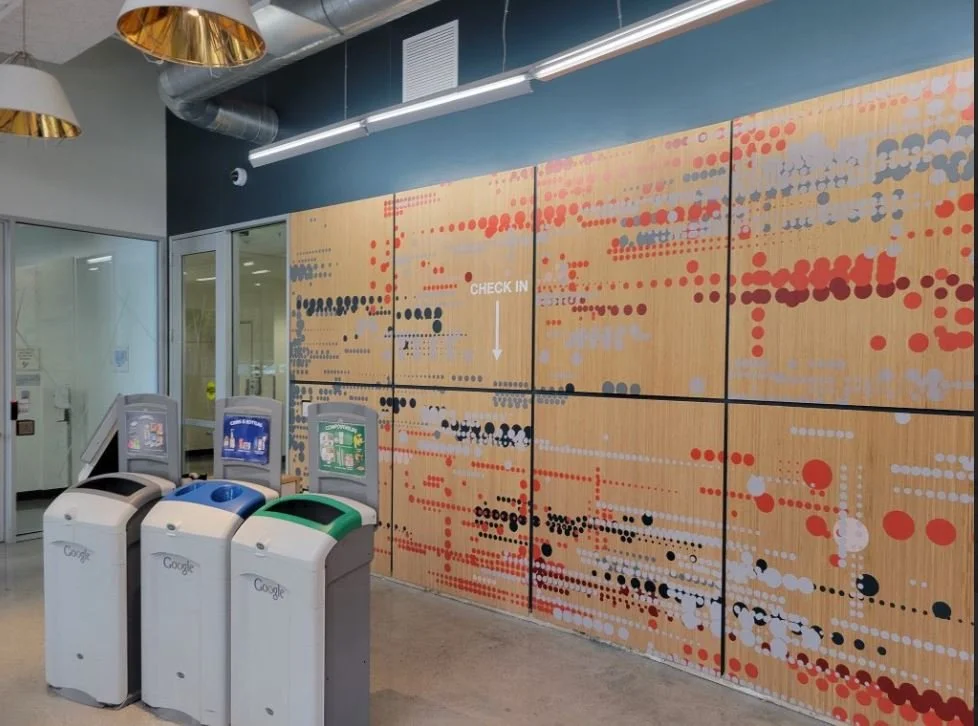 Wood feature wall combined with environmental graphics for branded corporate interior