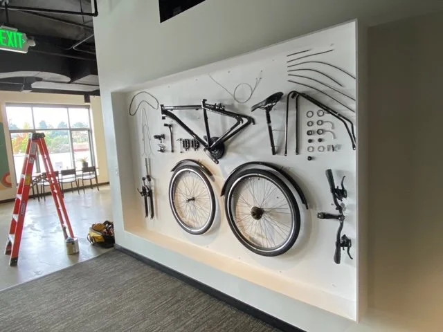 Large-scale custom wall installation combining graphics and dimensional elements to create an engaging visual focal point.