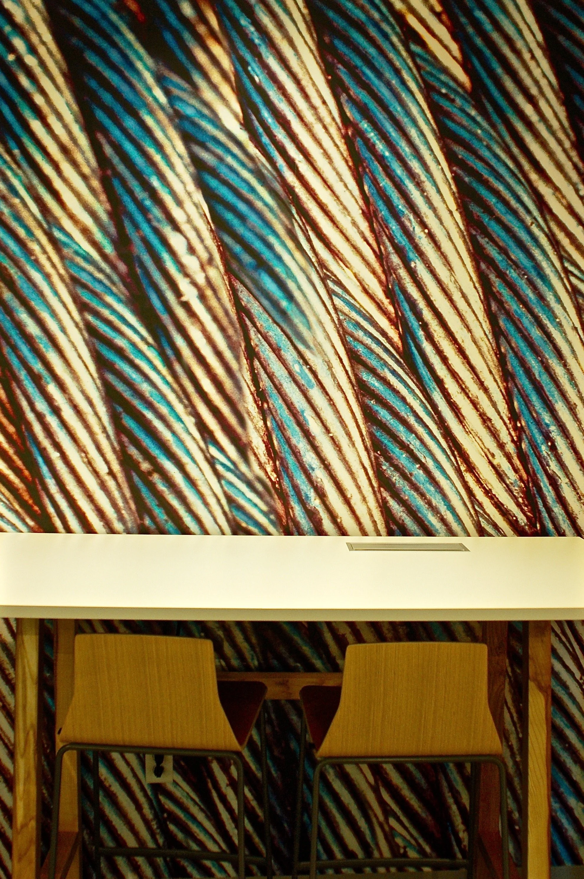 Textured pattern wallcovering adding visual depth and material-inspired design to a commercial interior.