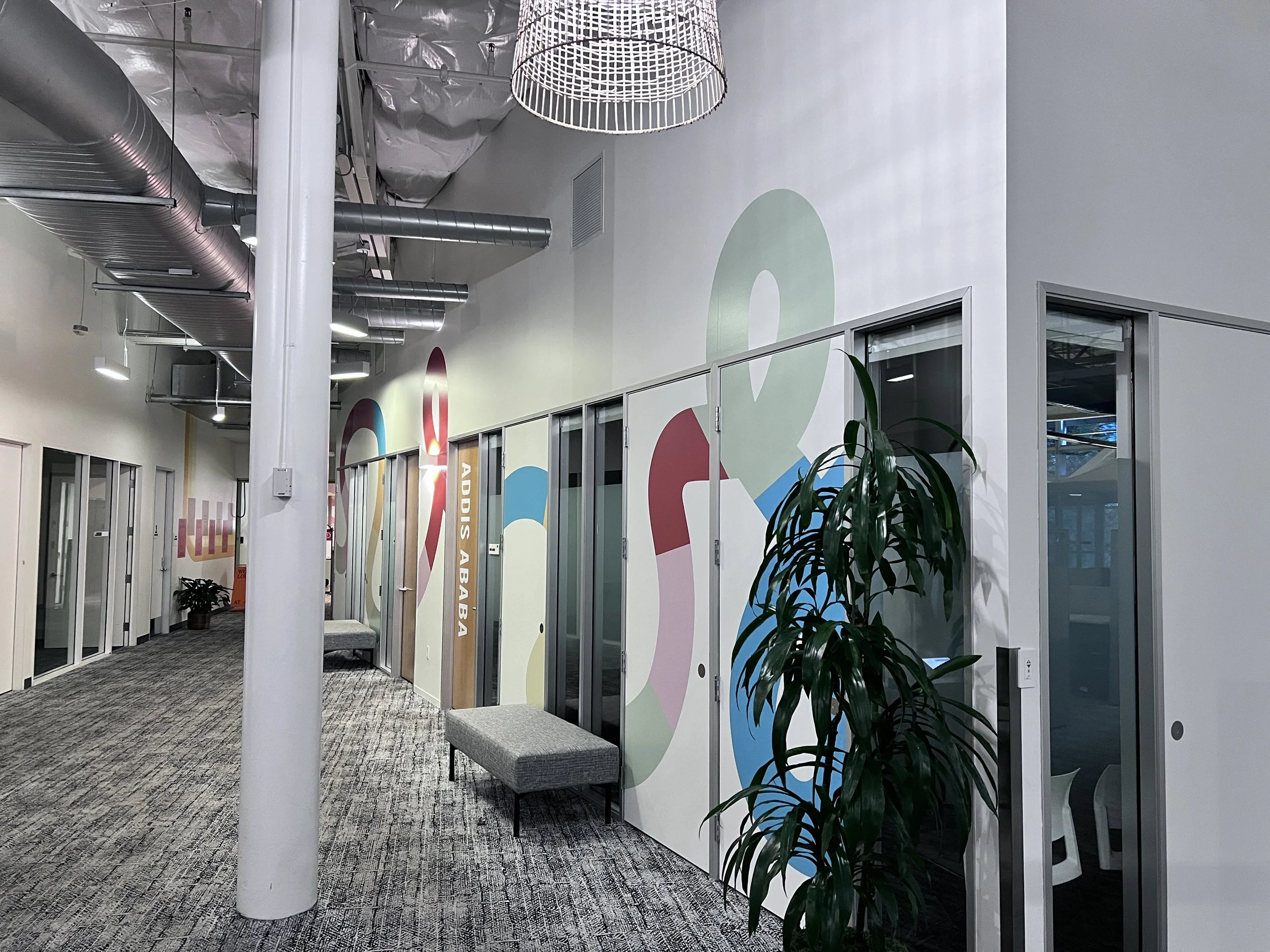 Custom branded environmental graphics installed in the Amphitheatre meeting spces.