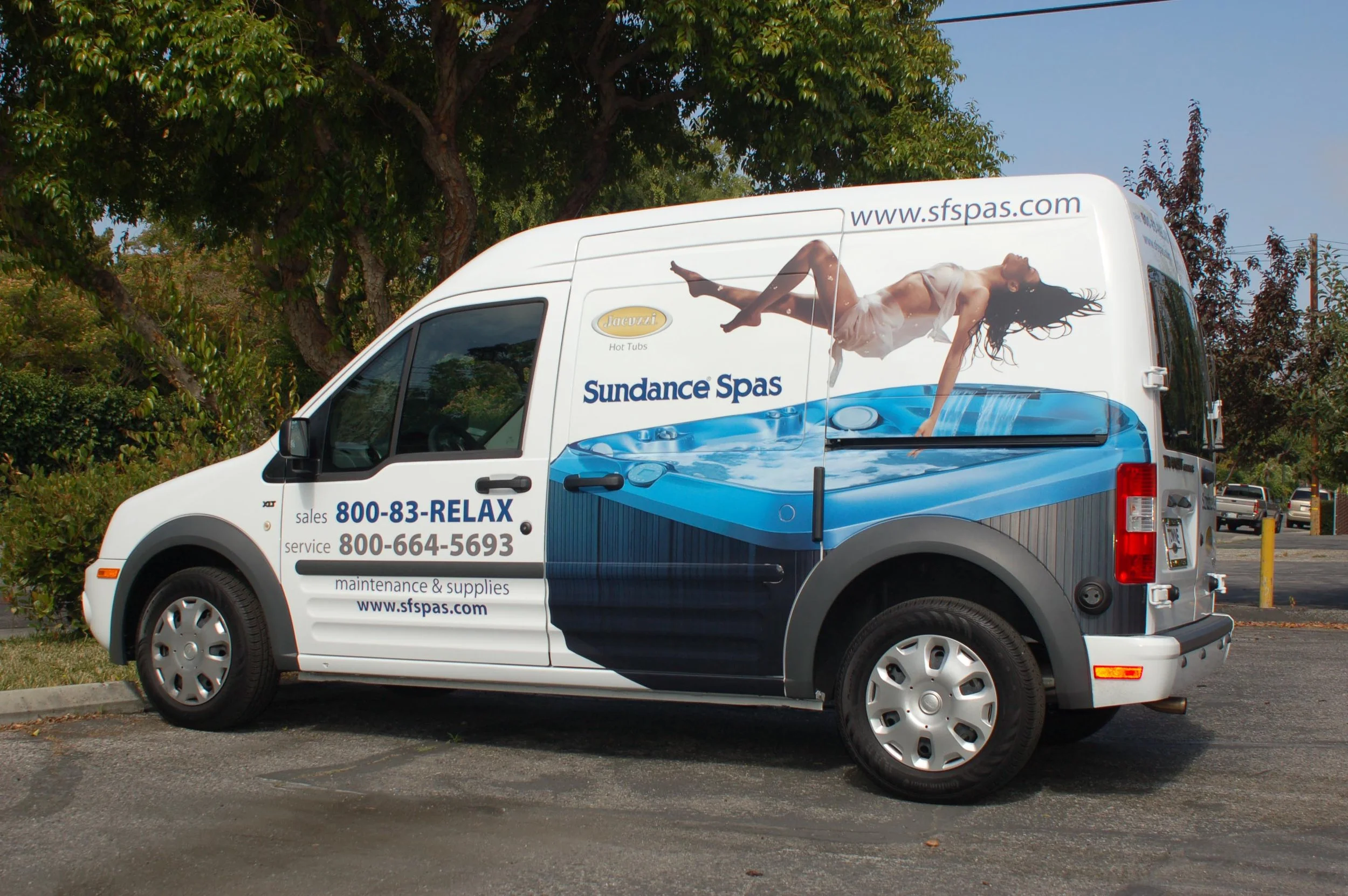 Truck with partial wrap and custom business graphics used for contractor or field service branding.