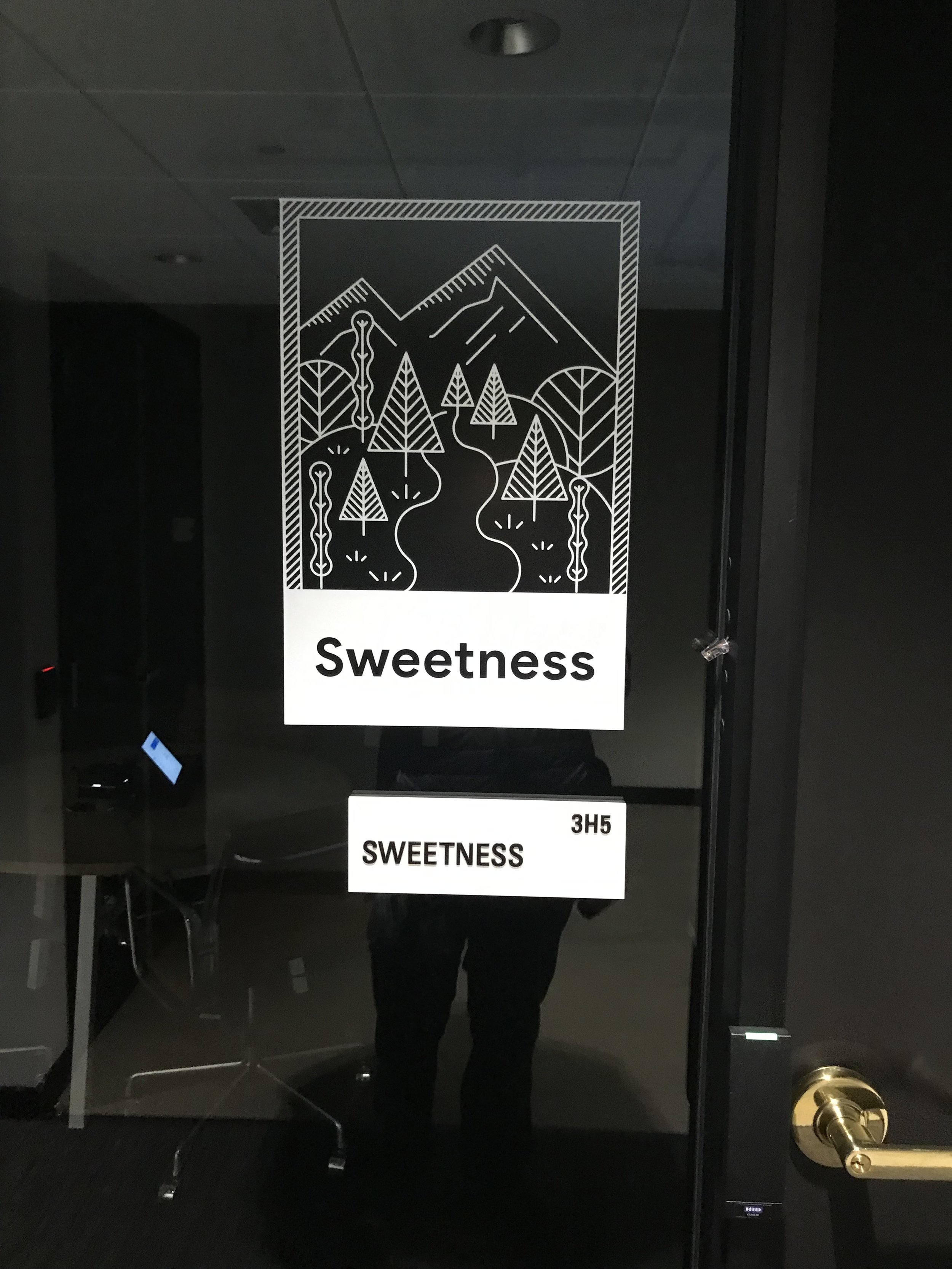 Digital room scheduling display integrated with conference room signage at Google Santa Cruz, supporting workplace wayfinding and space management.