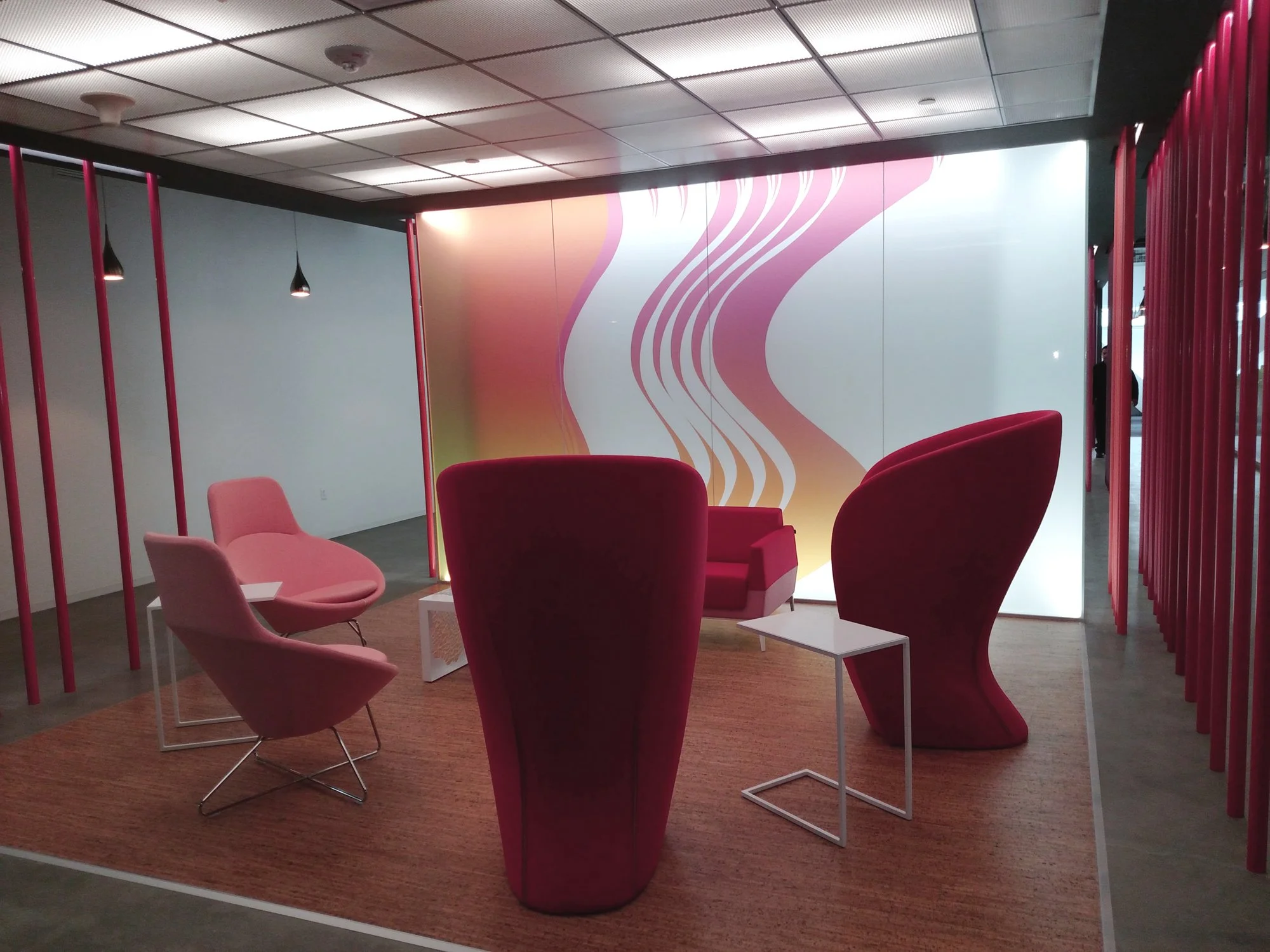Decorative gradient privacy window film installed on office glass walls with custom color design for modern workplace interiors.