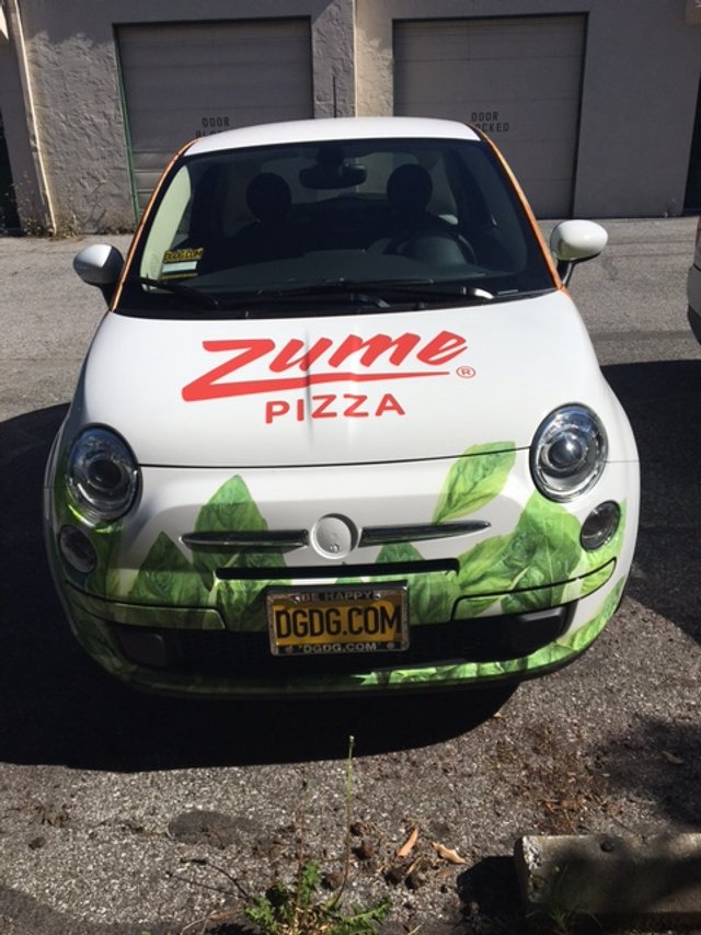 Custom commercial vehicle wrap for Zume Pizza delivery car with logo and full-color graphics