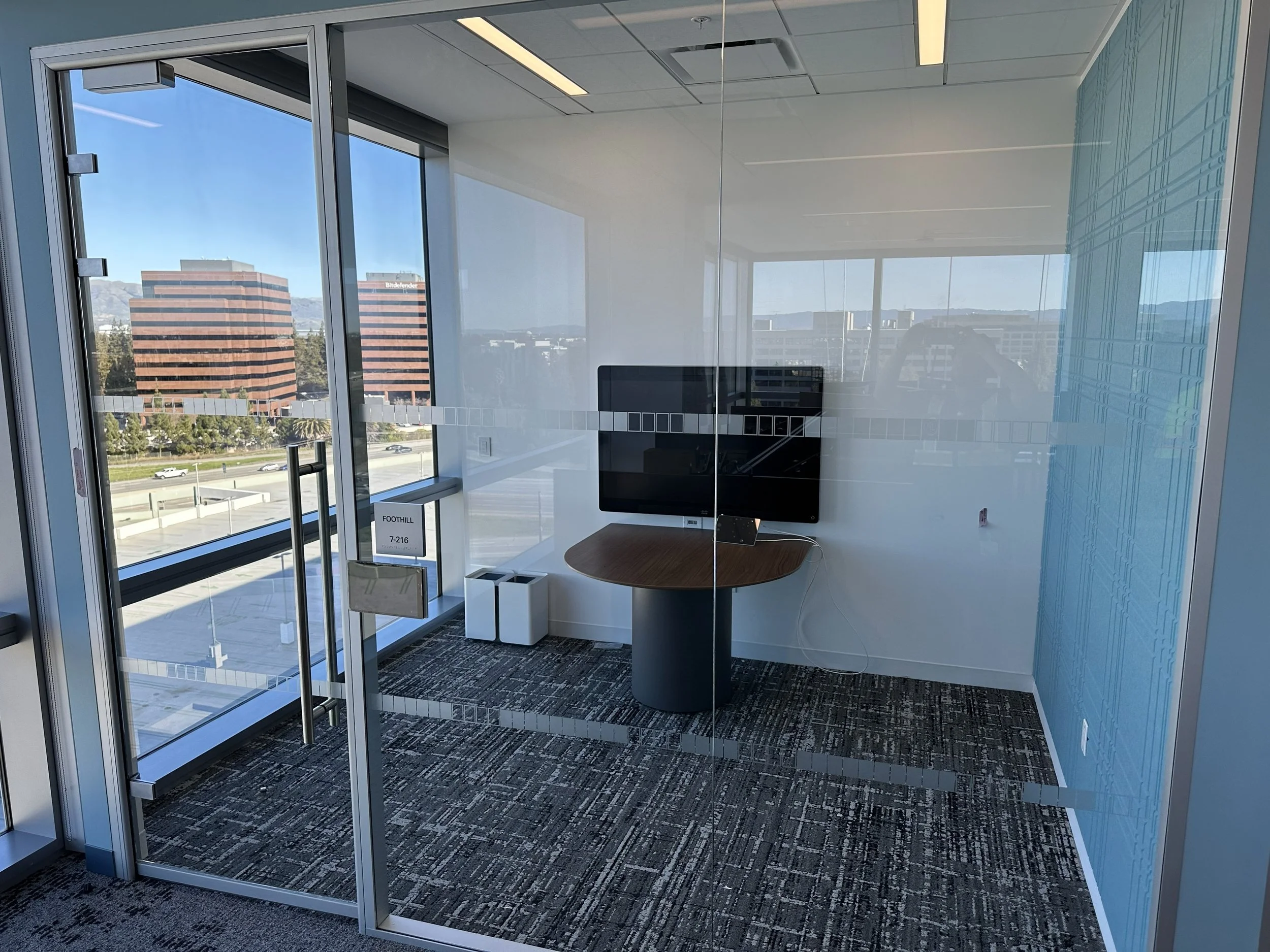 Glass conference room with distraction band window film installed for safety and privacy at the KPMG San Jose office.
