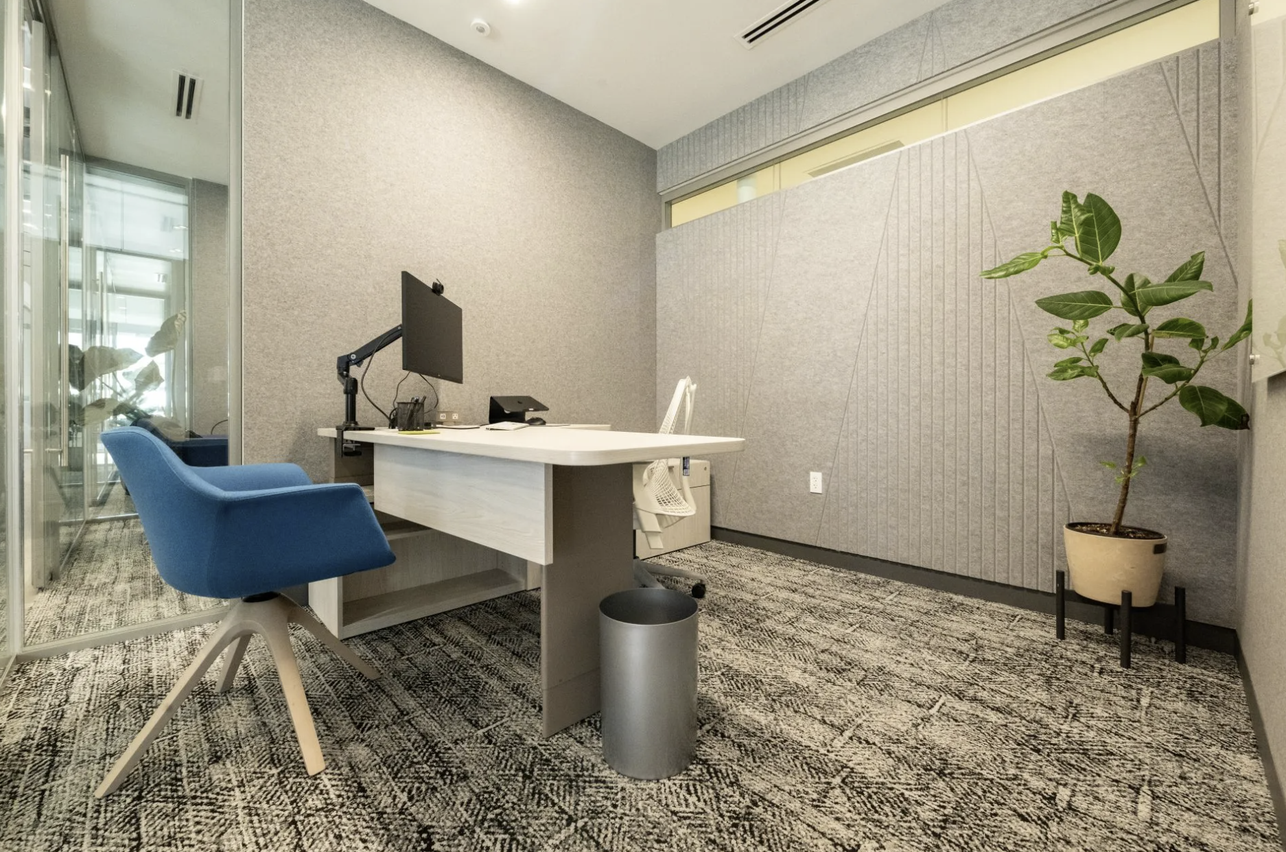 Private office with Acoufelt PET acoustic wall panels installed to improve sound control and create a quiet, modern workspace.