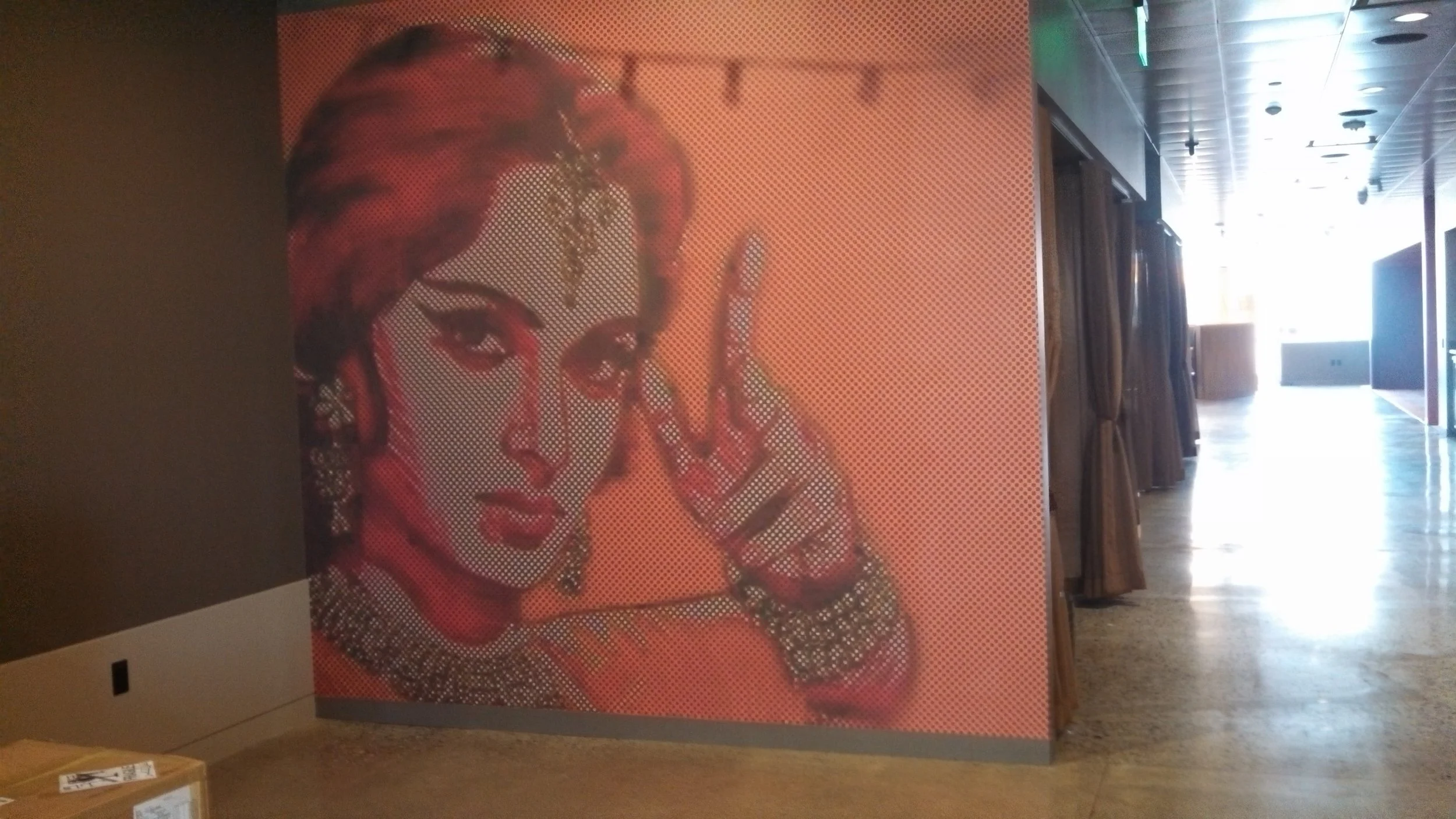 Close-up of textured custom wallcovering with artistic illustration for a specialty feature wall application.