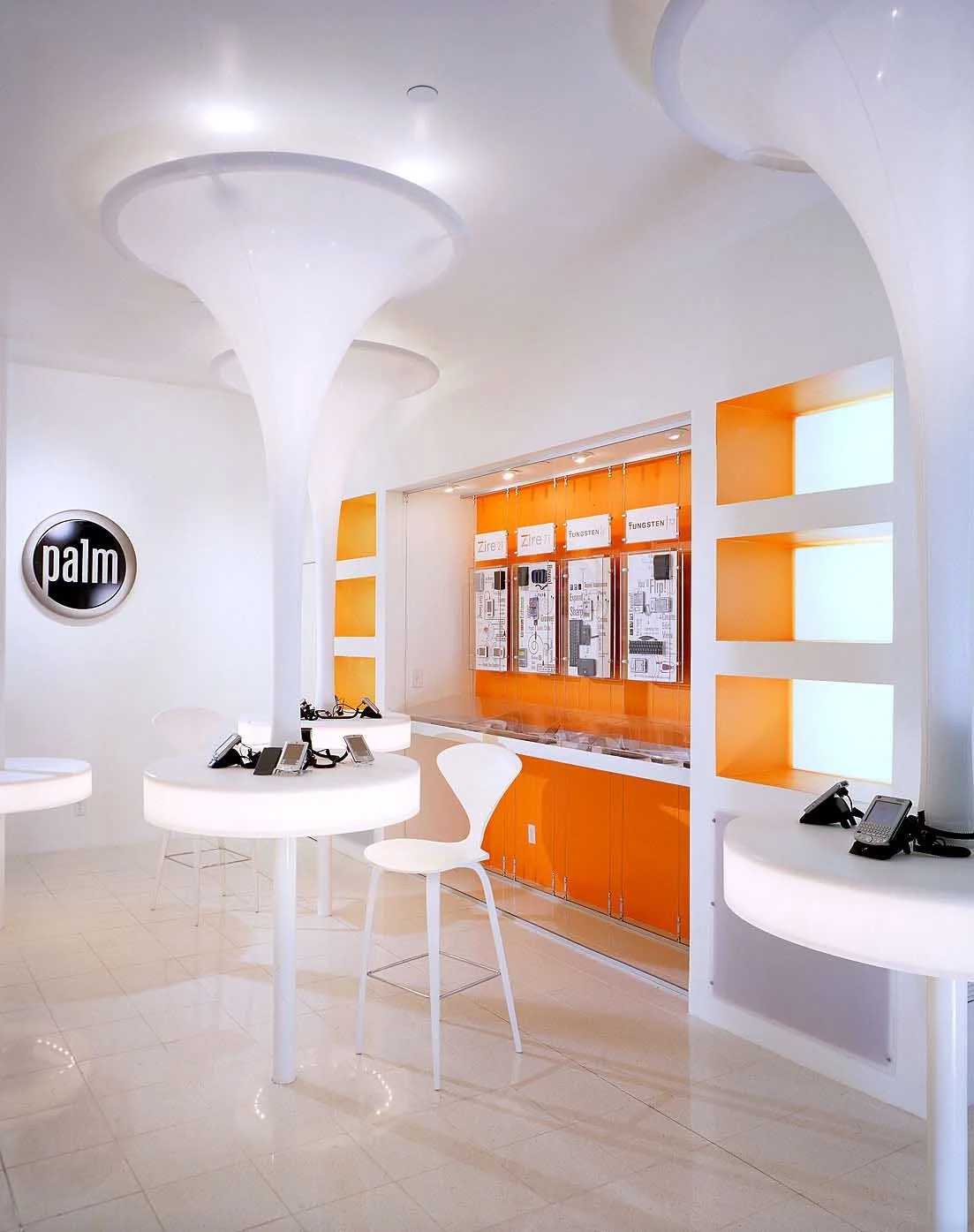 Retail-inspired experiential display environment with custom fixtures and branded product presentation