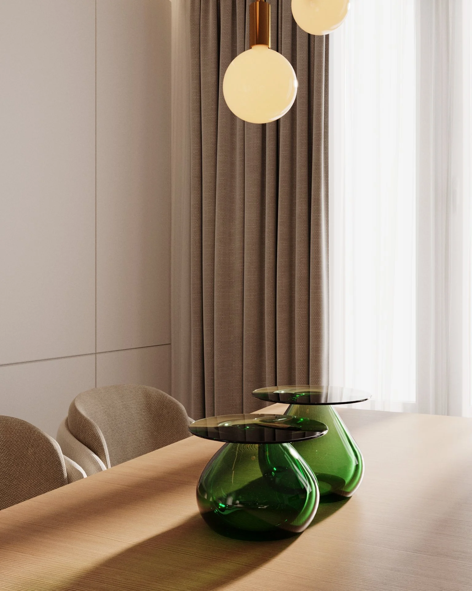 A dining room with beige chairs, a wooden table, two green glass vases, a modern hanging light fixture with round bulbs, beige curtains, and sheer white curtains allowing natural light.