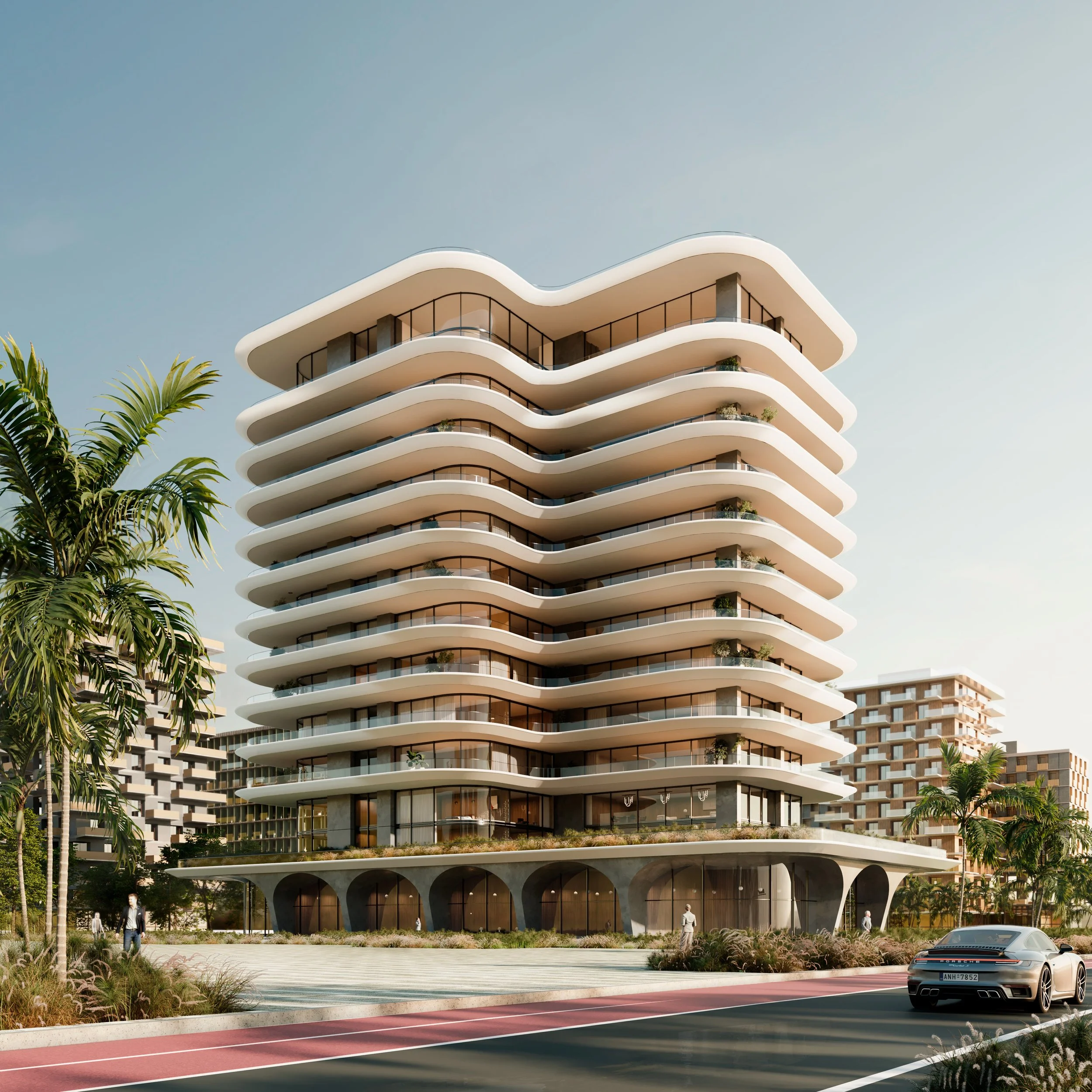 Modern multi-story apartment building with curved balconies, palm trees, and a sports car in the foreground.