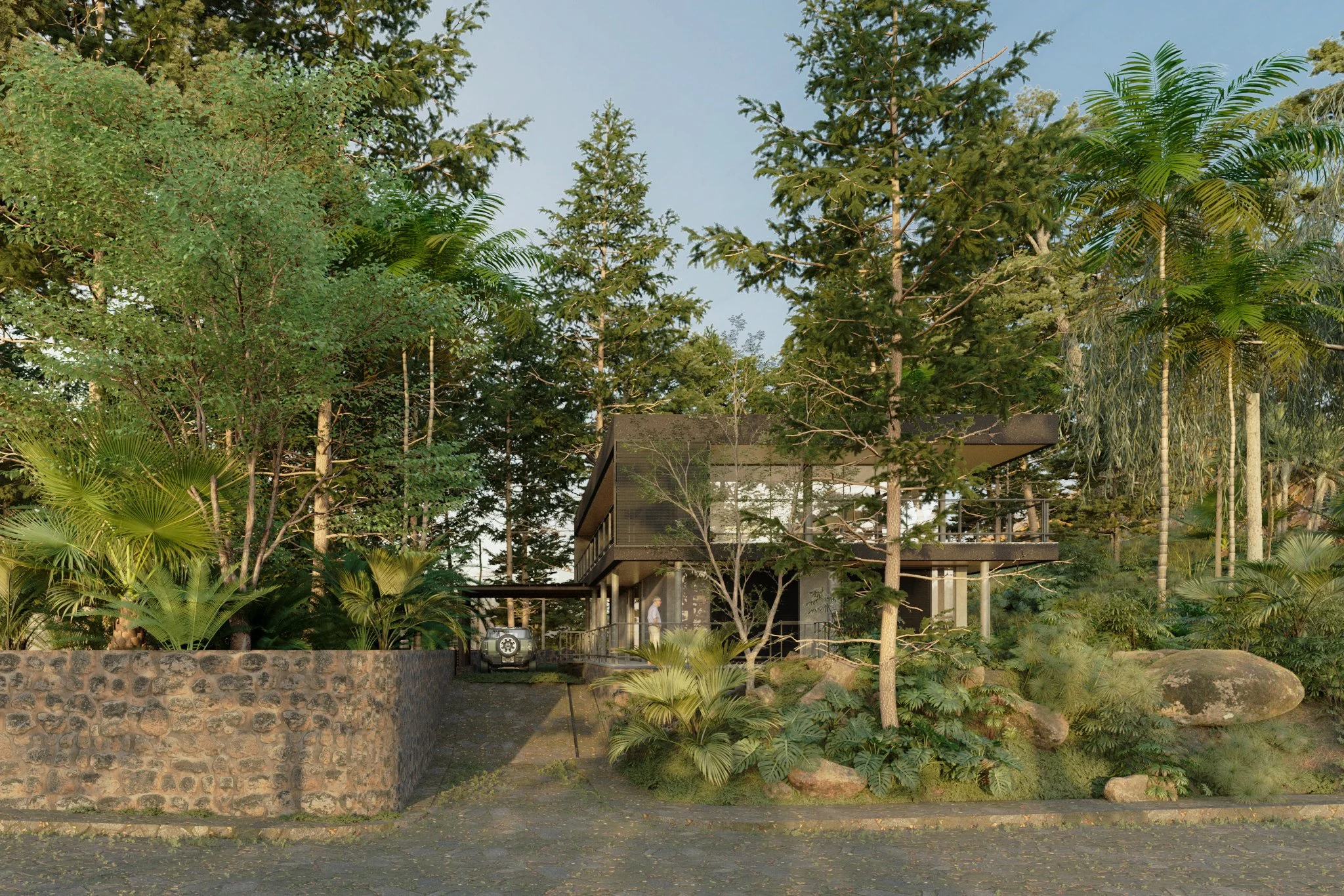 Modern house surrounded by lush green trees and plants, with a stone wall and driveway in the foreground.