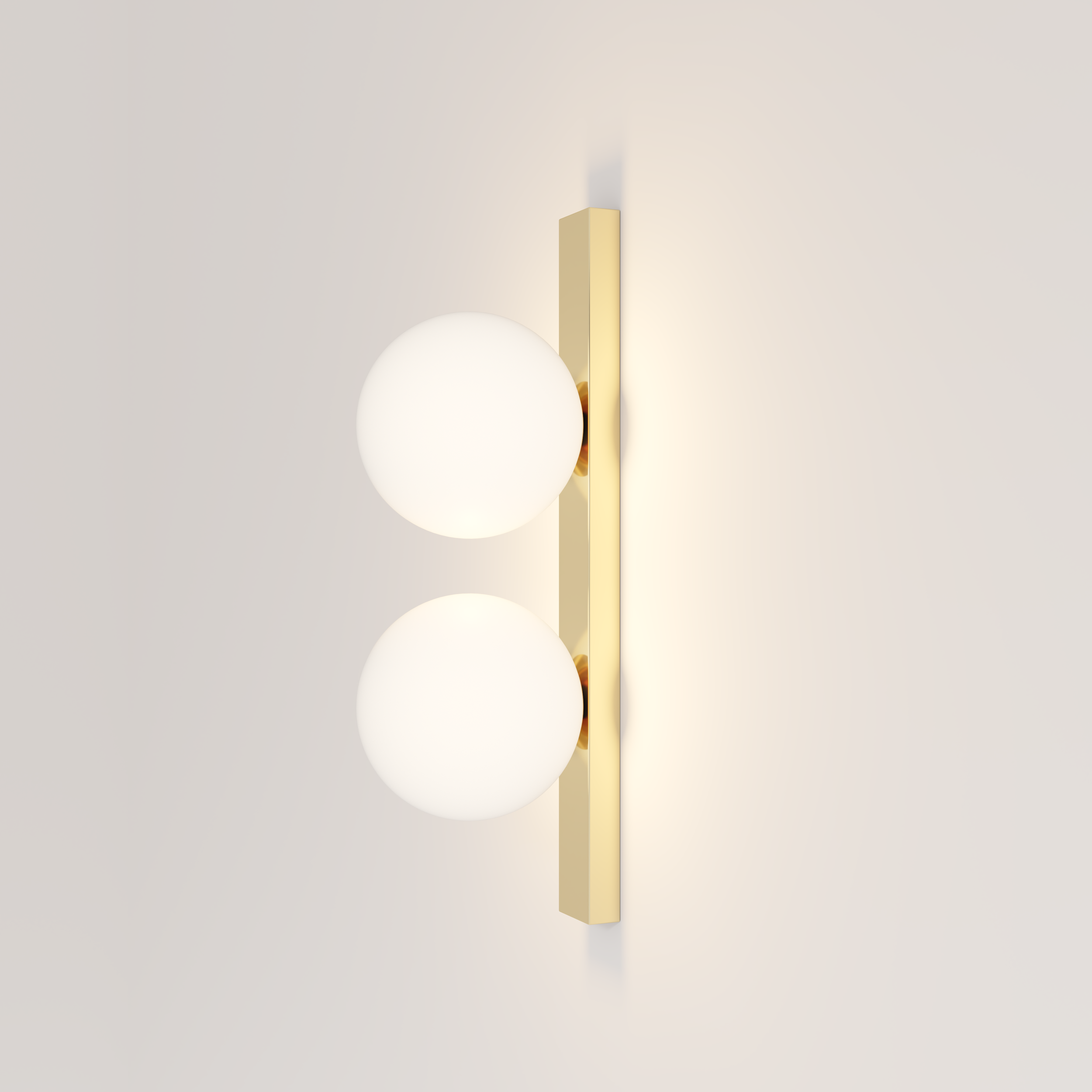 Modern wall-mounted light fixture with two spherical white glass globes and a brass vertical backplate on a white wall.