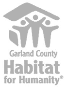Gray logo with two angel wings above the words 'Habitat for Humanity' and the slogan 'More Than a House'