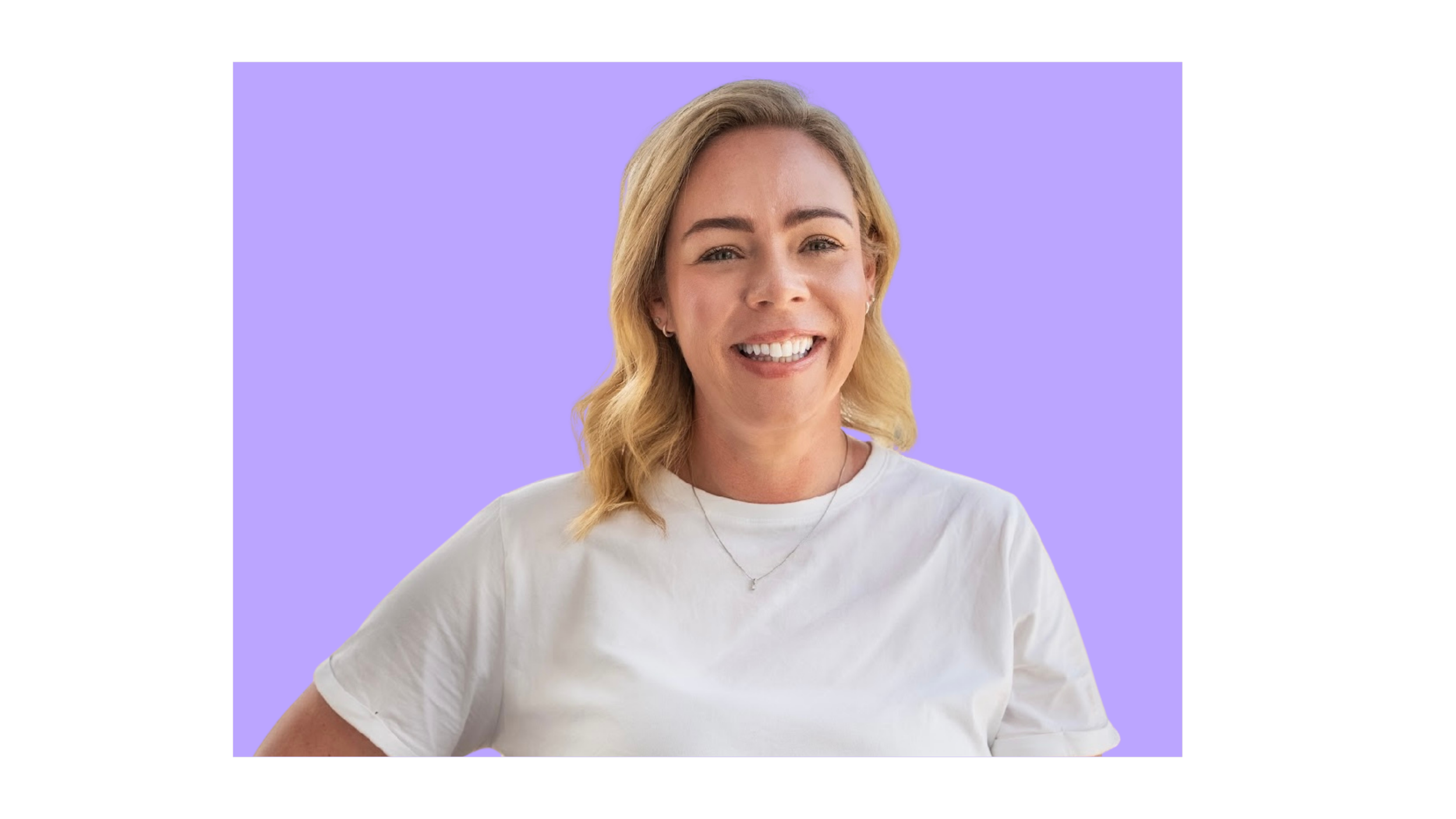 A smiling woman with blonde hair in a white t-shirt and small necklace, standing against a purple background.