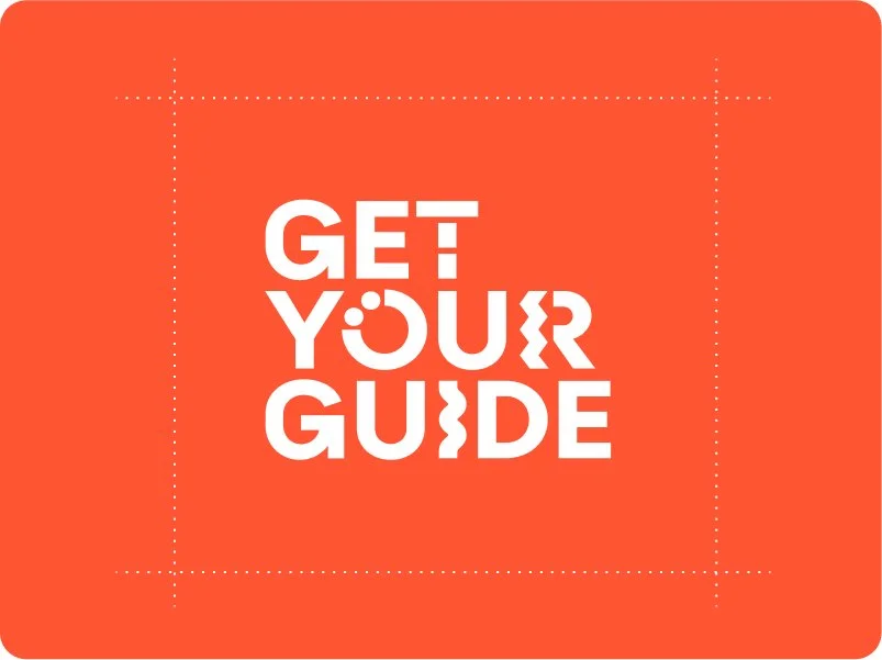 Orange background with white text that reads 'Get Your Guide' with the 'O' stylized as a circle with a dot above it.