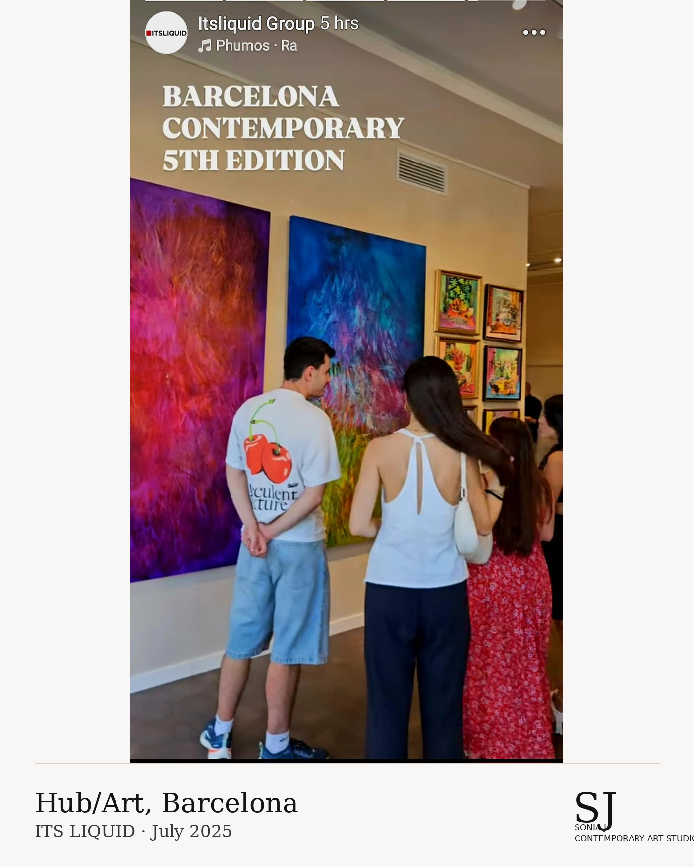 People viewing colorful abstract paintings at an art exhibition in Barcelona, July 2025.
