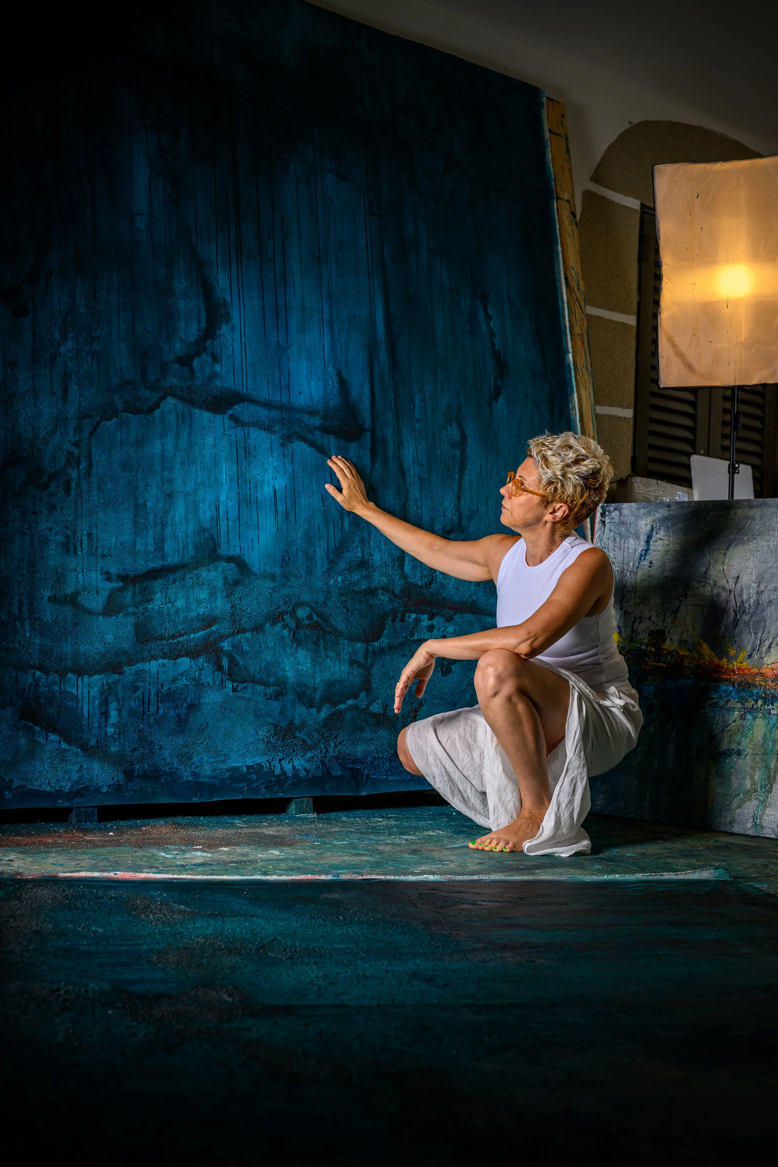 Sonia Jeronimo in her studio with a large-scale Atmospheric Blue painting, Serra da Estrela, Portugal.