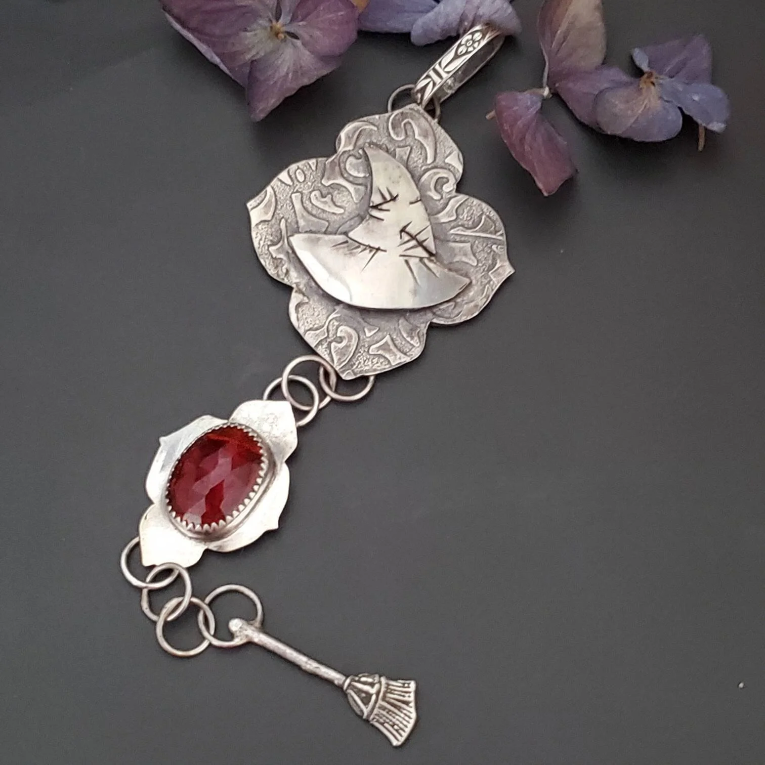 It's a Big Stupid Hat Silver Garnet Pendant