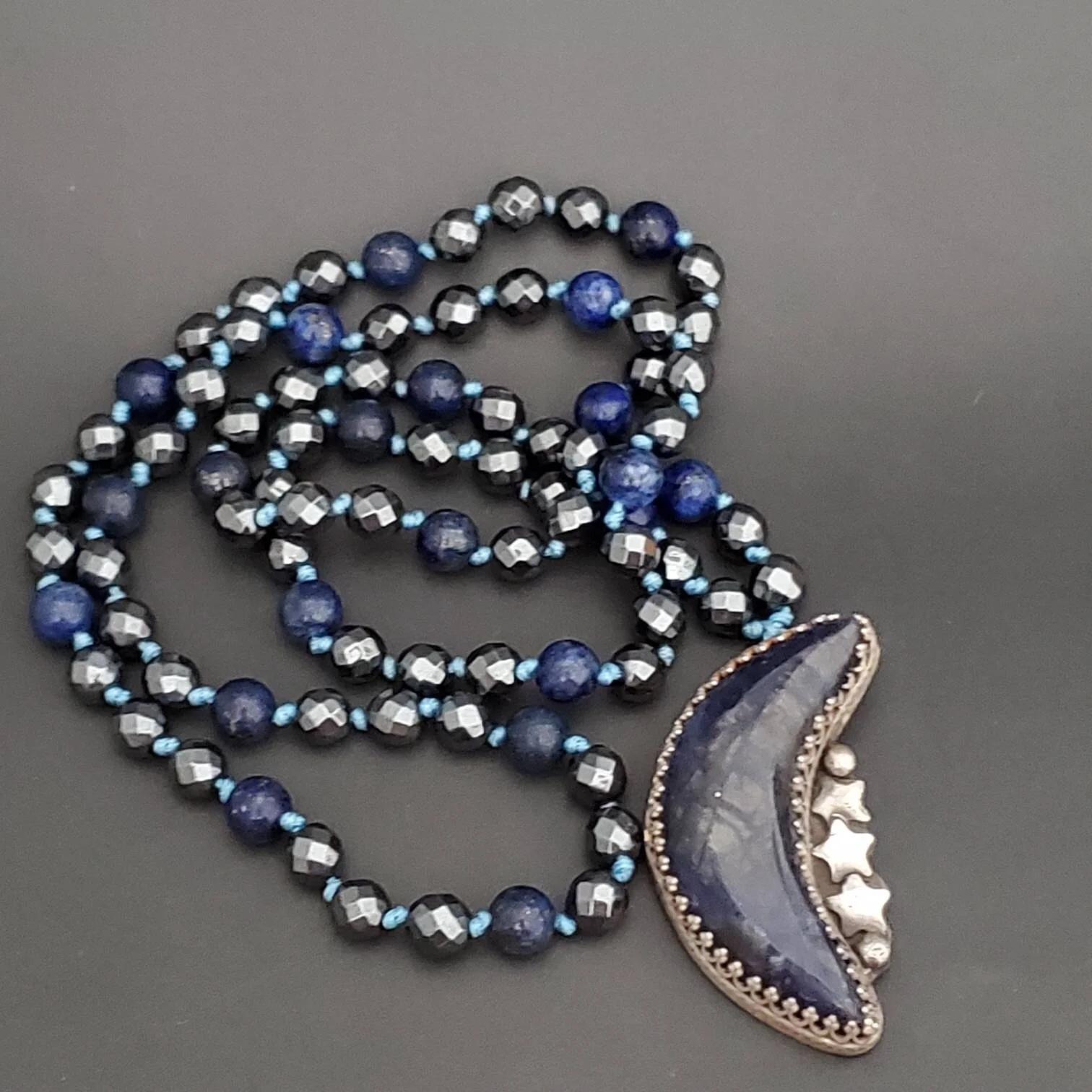 Chatoyant Sodalite Crescent Moon Necklace with Hand Knotted Strand of Hematite and Lapis Lazuli