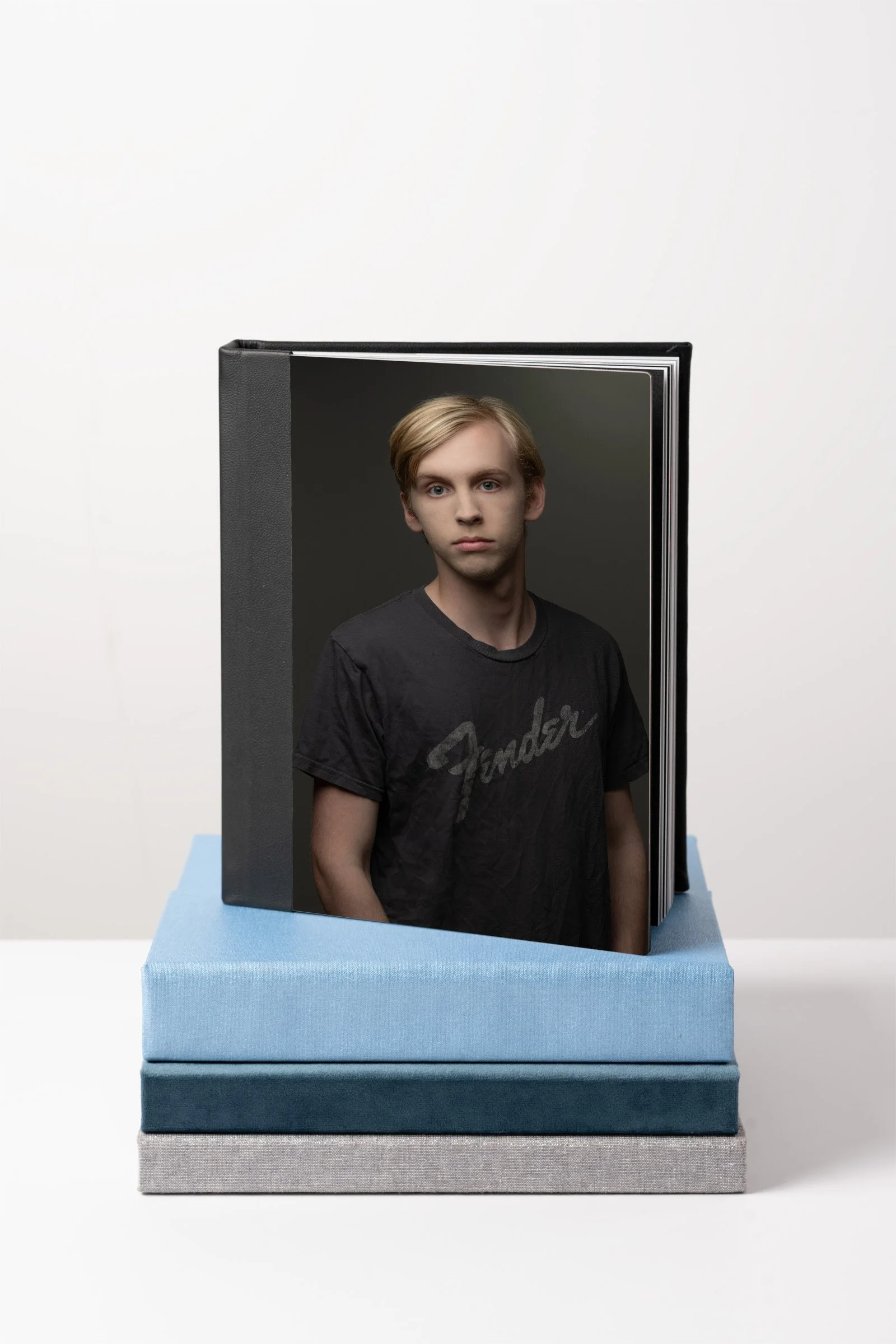 Connell on cover of stacked albums.jpg